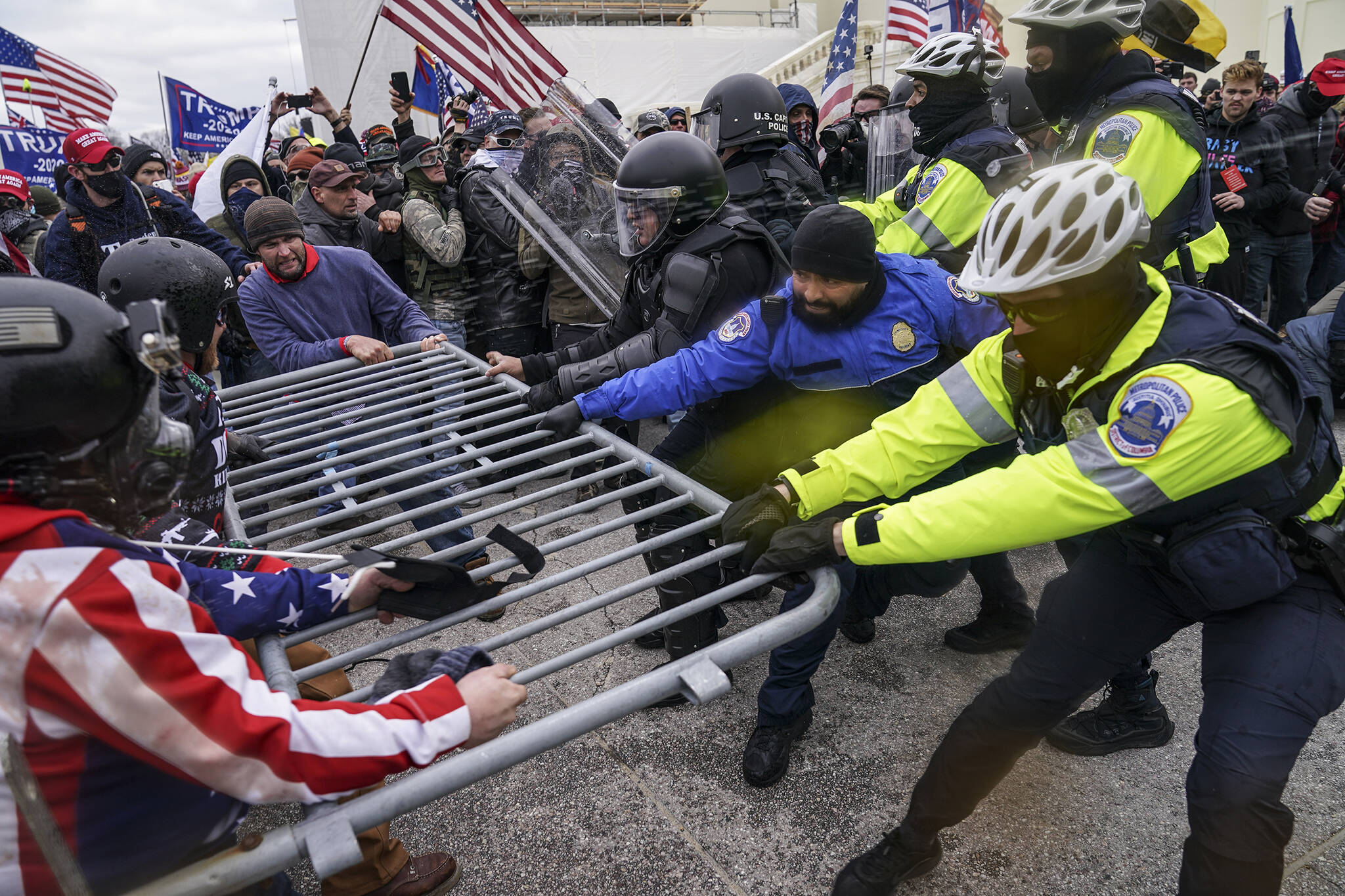 Rioters try to break through a police barrier at the Capitol in Washington on Jan. 6, 2021. Members of the House committee investigating the events of Jan. 6 will hold their first prime time hearing Thursday, June 9, 2022, to share what they have uncovered. (AP Photo / John Minchillo)