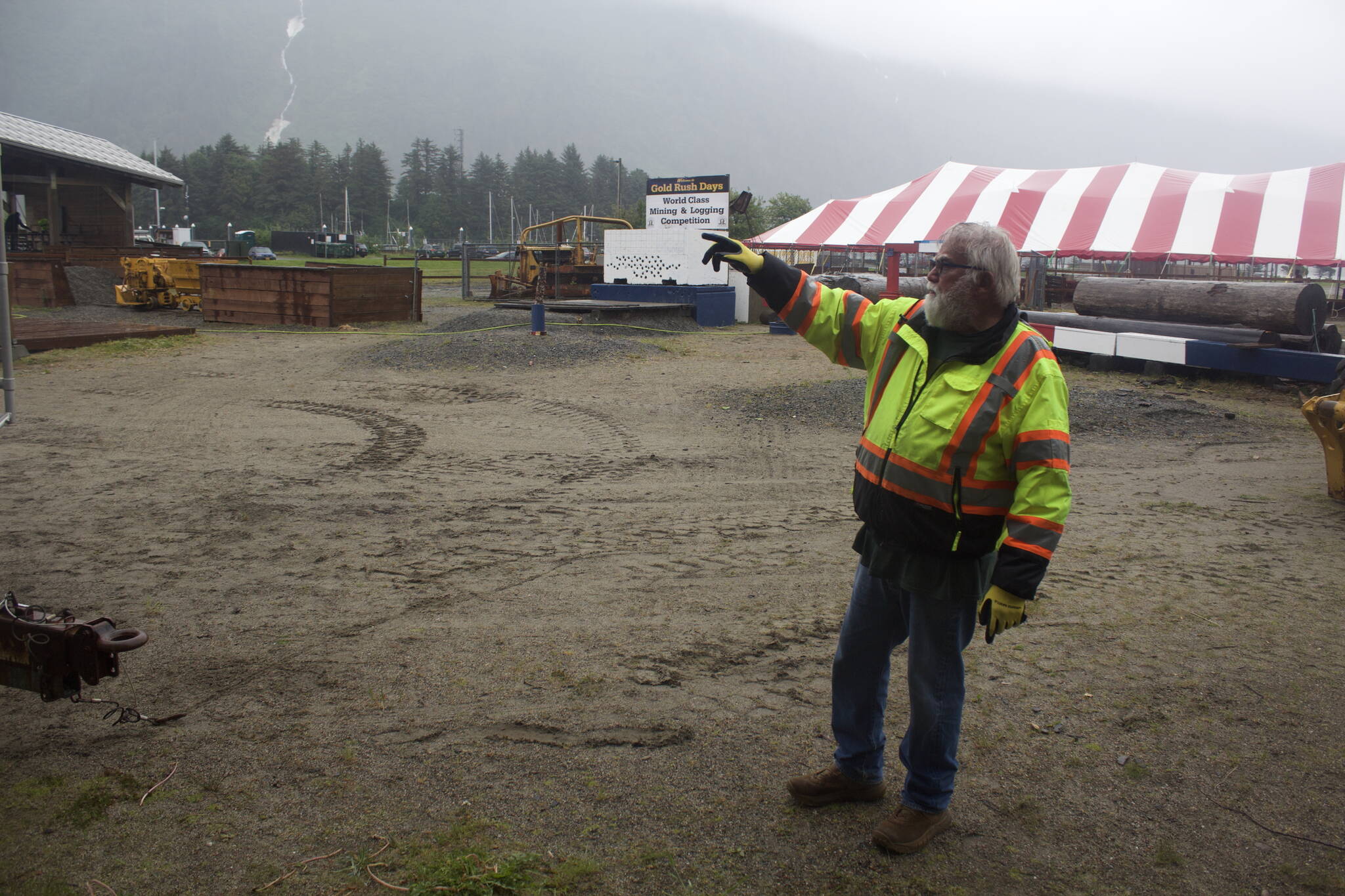 Jerry Harmon, president of Juneau Gold Rush Days and a miner for more than 40 years, shows some of the nearly 500,000 pounds in heavy equipment being brought to Savikko Field for this weekend’s events. The event has attracted an estimated 10,000 people at its peak, but was cancelled the past two years due to the COVID-19 pandemic. (Mark Sabbatini / Juneau Empire)