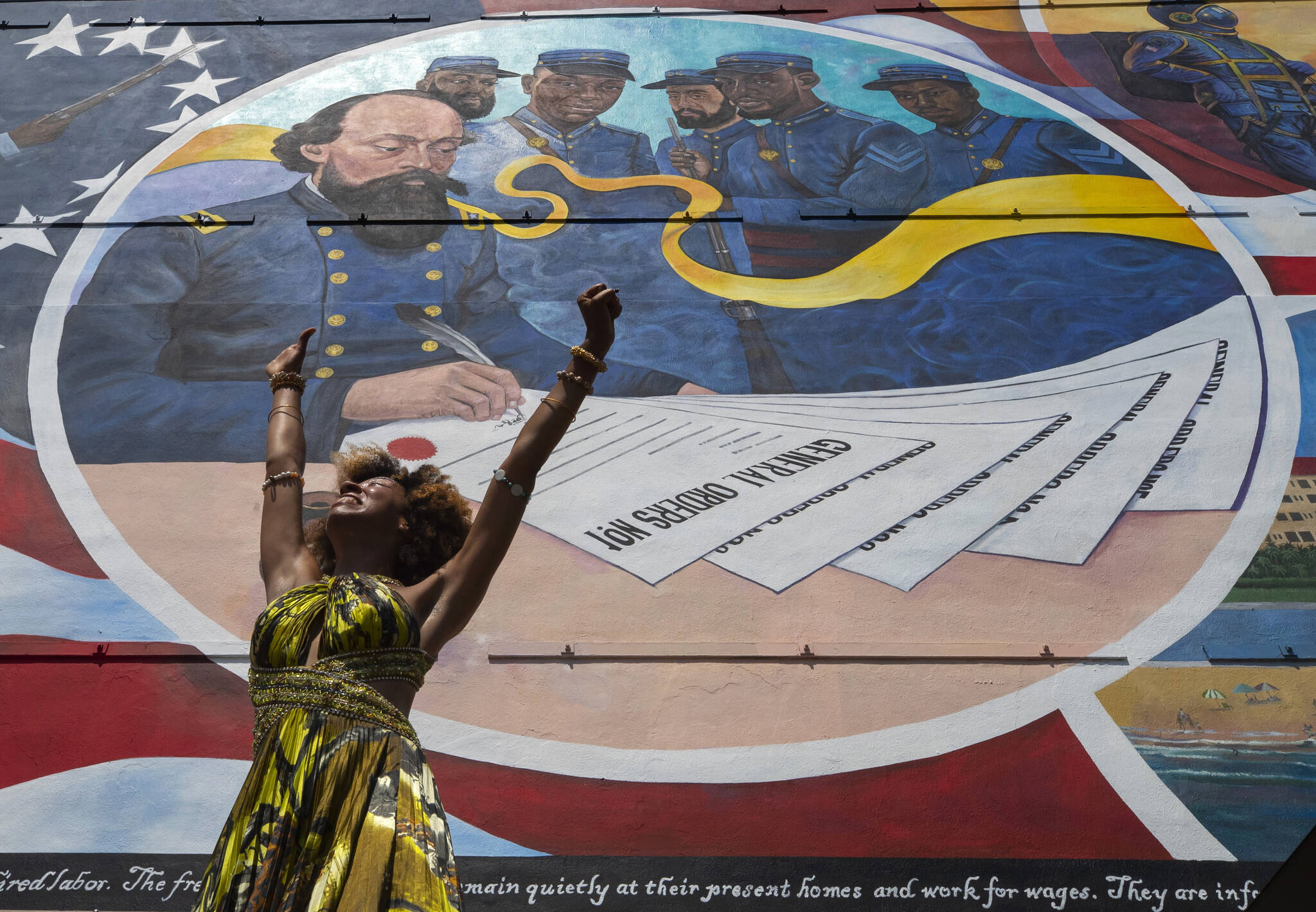 Dancer Prescylia Mae, of Houston, performs during a dedication ceremony for the mural “Absolute Equality” in downtown Galveston, Texas, on June 19, 2021. Recognition of Juneteenth, the effective end of slavery in the U.S., gained traction after the police killing of George Floyd in 2020. But after an initial burst of action, the movement to have it recognized as an official holiday in the states has largely stalled. (Stuart Villanueva / The Galveston County Daily News)