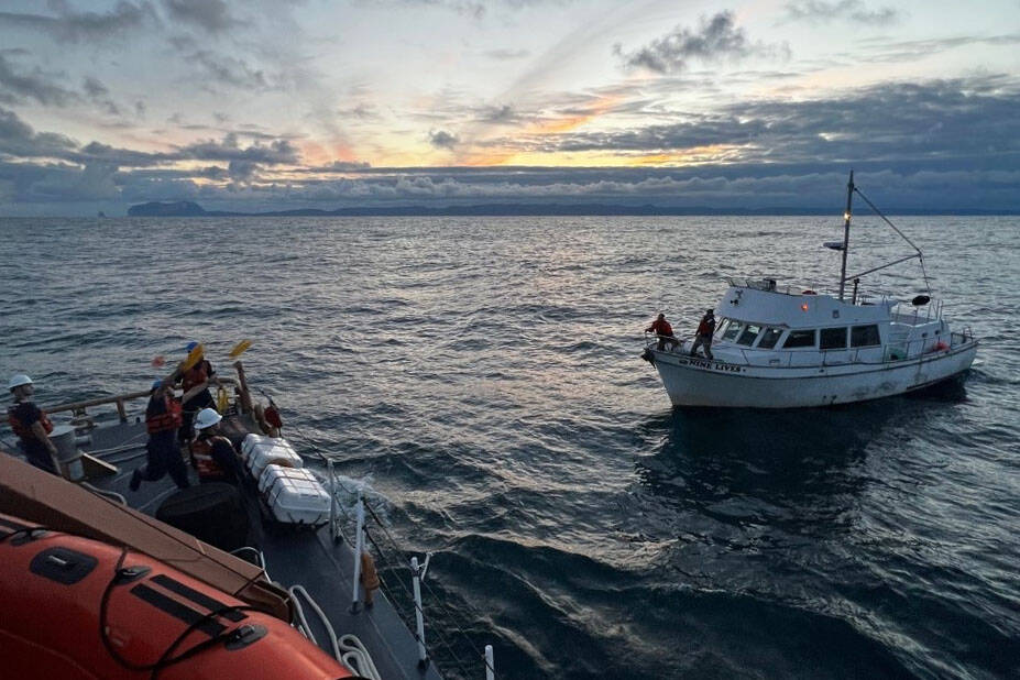 Coast Guardsmen aboard the cutter Liberty, recently re-homeported from Juneau to Valdez, take the vessel Nine Lives under tow after fuel contamination rendered its engine nonfunctional on Tuesday, June 14, 2022. (Courtesy photo / U.S. Coast Guard)