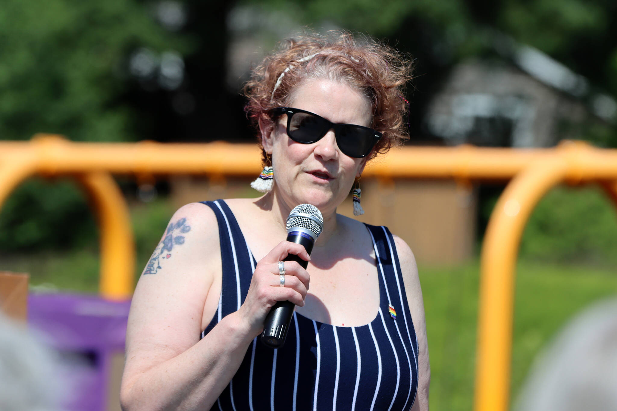 Dr. Amy Dressel, a pediatrician who worked with and admires Dr. George Brown, speaks Saturday during a plaque dedication and installation ceremony at Project Playground. Dressel said Brown is who she would like to be when she grows up. (Ben Hohenstatt / Juneau Empire)