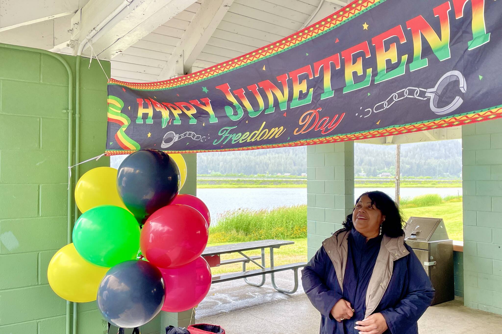 Sherry Patterson, president of the Black Awareness Association in Juneau, looks out as the group sold sweet potato pies as a fundraiser for a college scholarship fund during a Juneteenth celebration on June 19, 2022. (Michael S. Lockett / Juneau Empire)