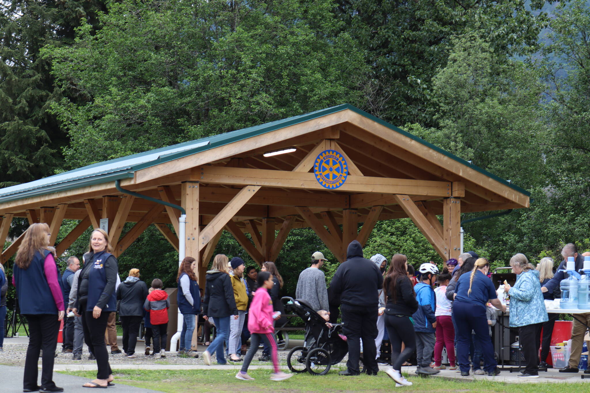 Over 100 people gathered Wednesday evening for the unveiling of a new pavilion at Riverside Rotary Park. (Clarise Larson / Juneau Empire)