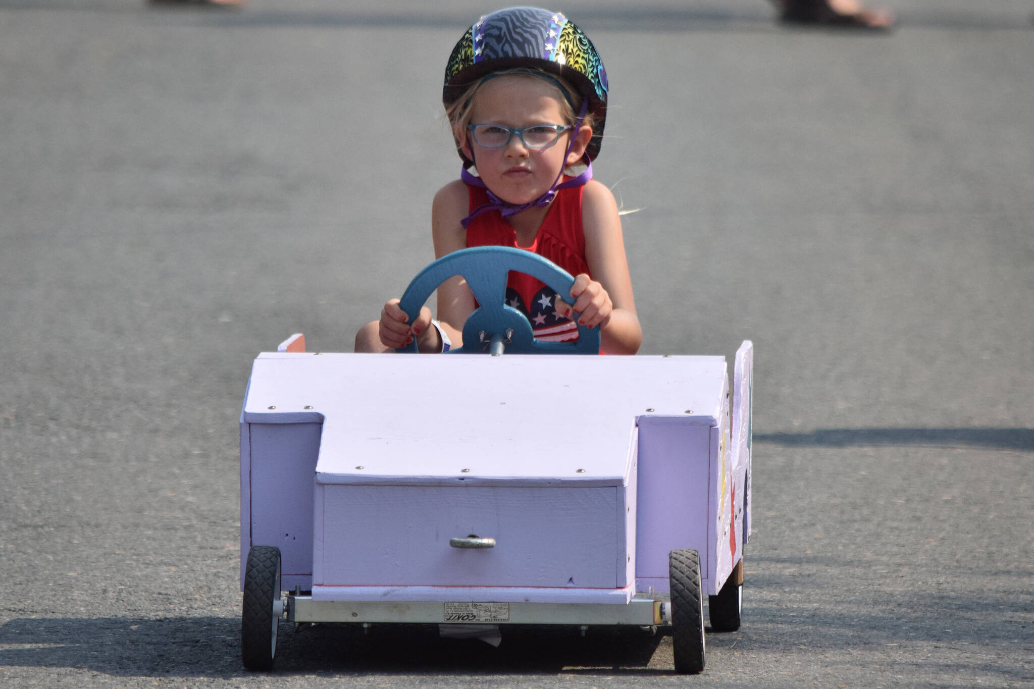 Amelia Farrell, 5, races down St. Ann’s Avenue at the Final Soapbox Challenge during the Douglas Fourth of July festivities on Thursday, July 4, 2019. (Nolin Ainsworth | Juneau Empire)