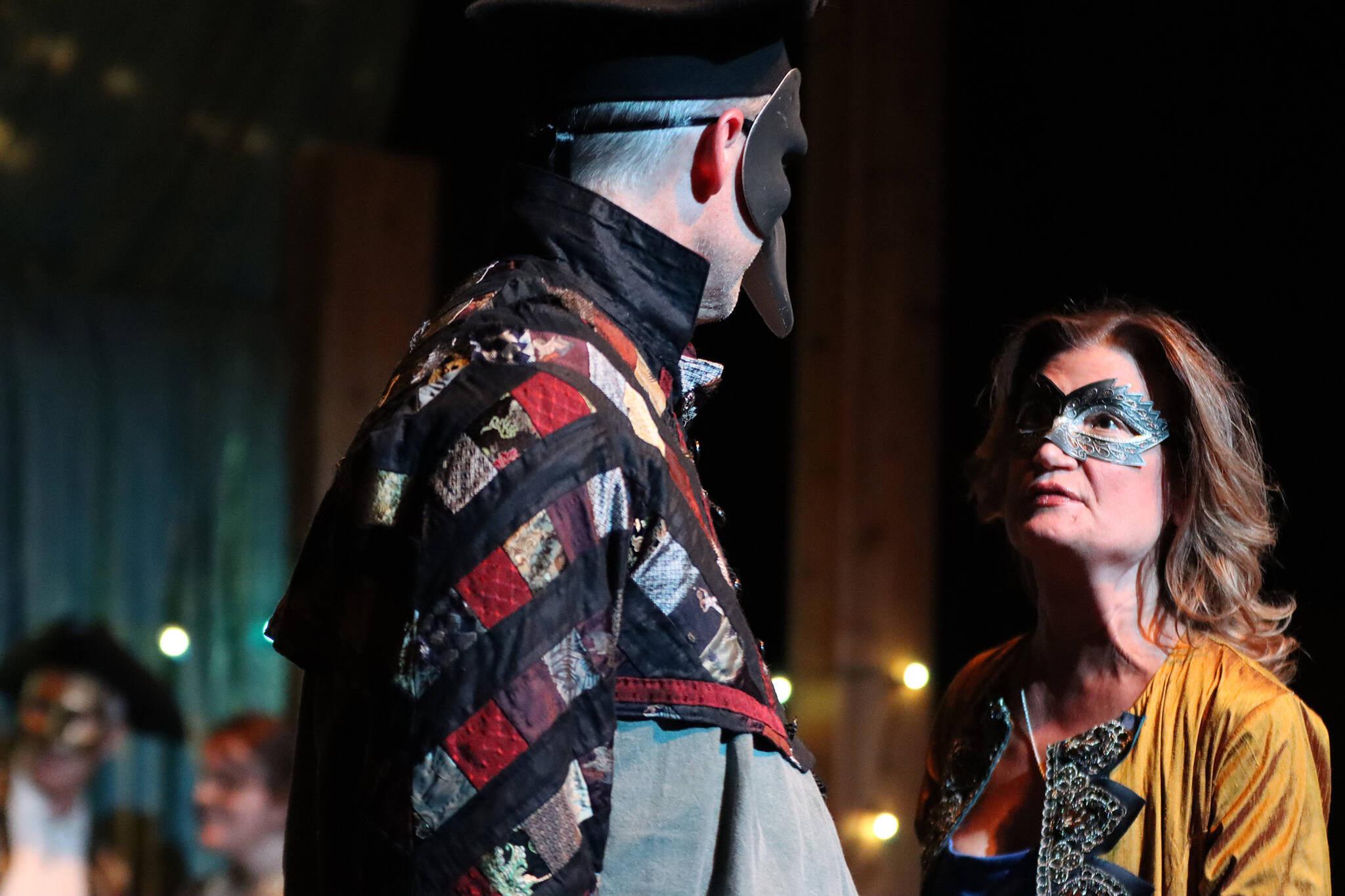 A masked Benedick (Aaron Elmore) and Beatrice (Katie Jensen) exchange repartee during dress rehearsal for Theatre in the Rough’s production of “Much Ado About Nothing.” (Ben Hohenstatt / Juneau Empire)