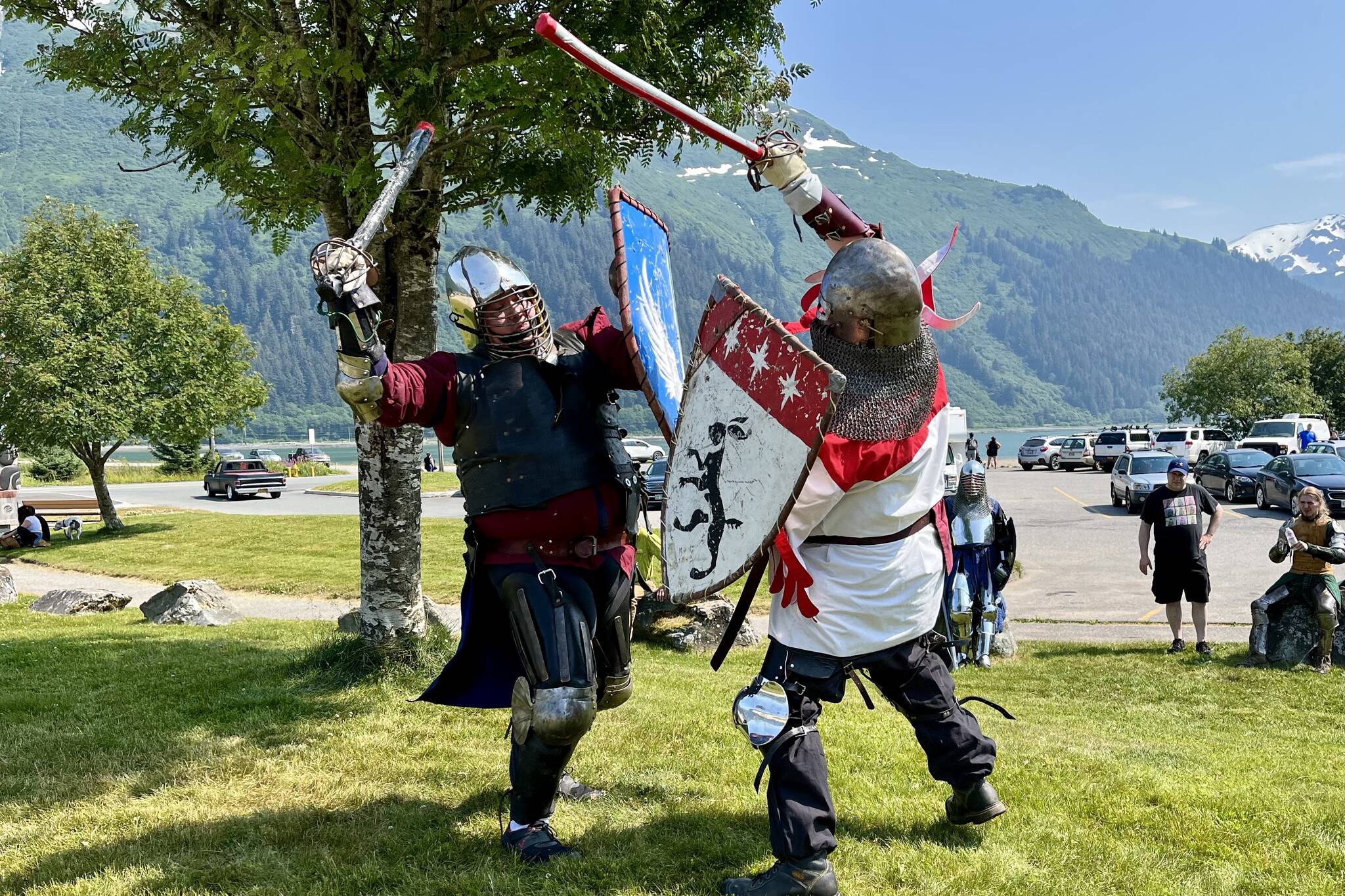 Hill Lewis, aka Rolland and Paul Caldwell, aka Alberic Hawk, duel to the death (sort of) for spectators during Douglas Fourth of July festivities. (Jonson Kuhn / Juneau Empire)
