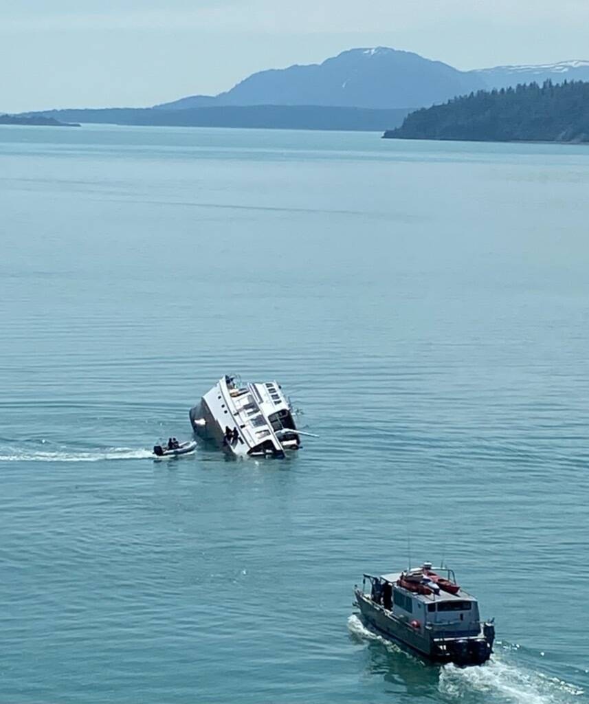 A Coast Guard aircrew and a Good Samaritan vessel rescued four mariners after their boat capsized in Glacier Bay National Park, Alaska, July 1, 2022. (Courtesy photo / USCG)