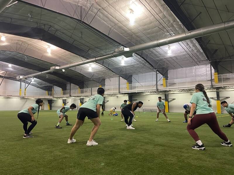 Former NFL defensive tackle Stephen Paea leads an exercise inside the Dimond Park Field House. The former pro has been helping local athletes refine their skills while in town. (Courtesy Photo)