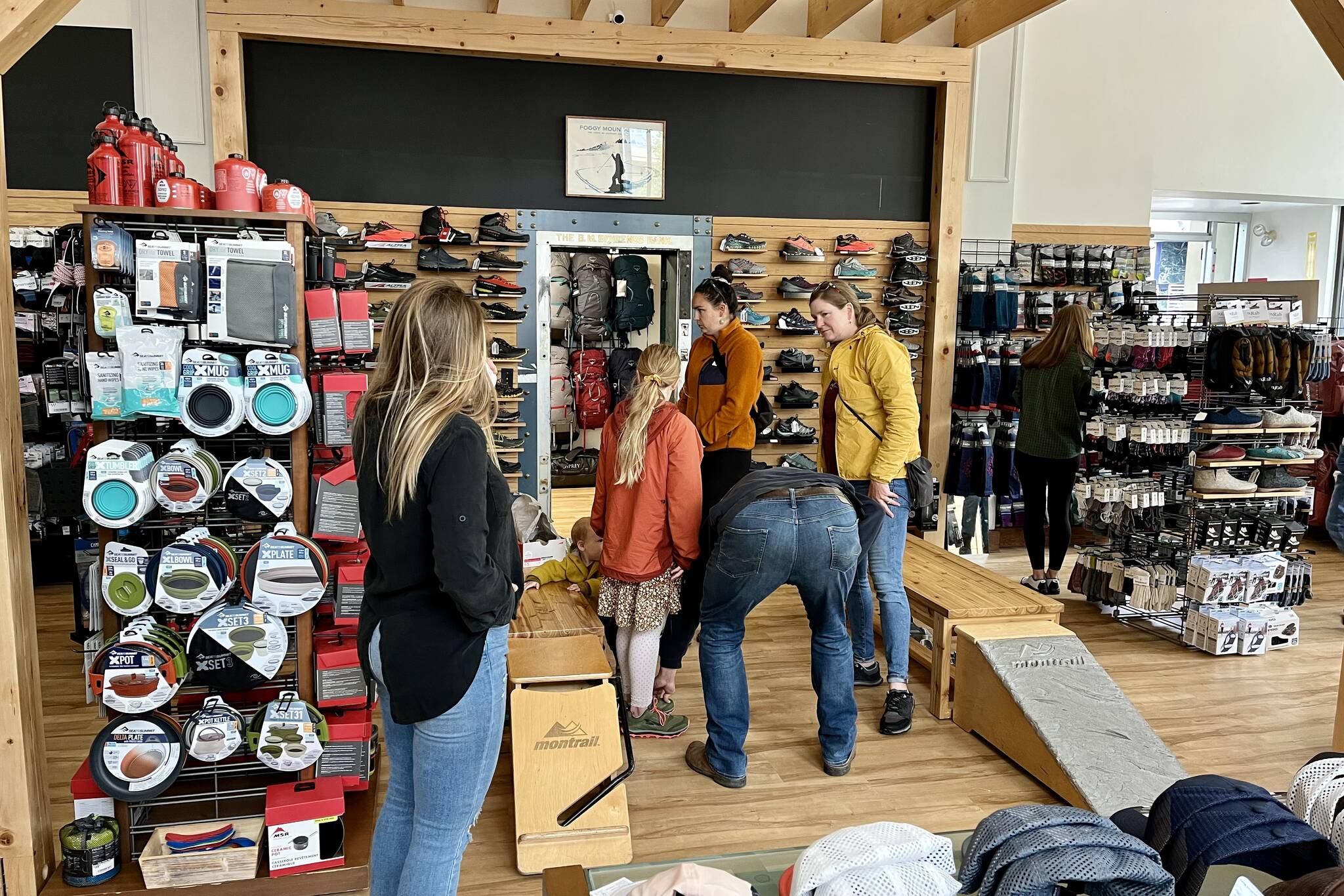 Jonson Kuhn / Juneau Empire
Foggy Mountain Shop co-owner Courtney Nicholl helps customers find all of their outdoor gear and accessories at new location.