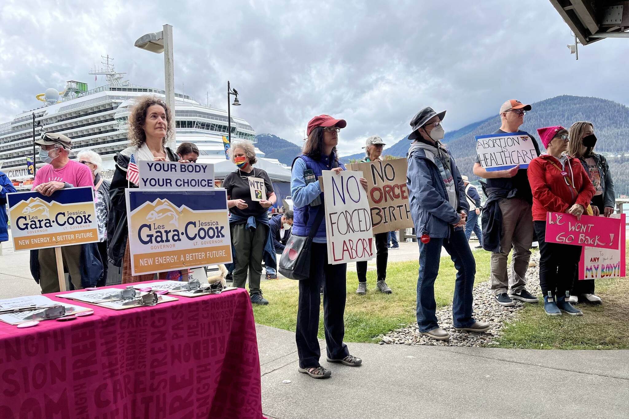 Crowd holding signs and showing solidarity at Saturday’s rally. (Jonson Kuhn / Juneau Empire)