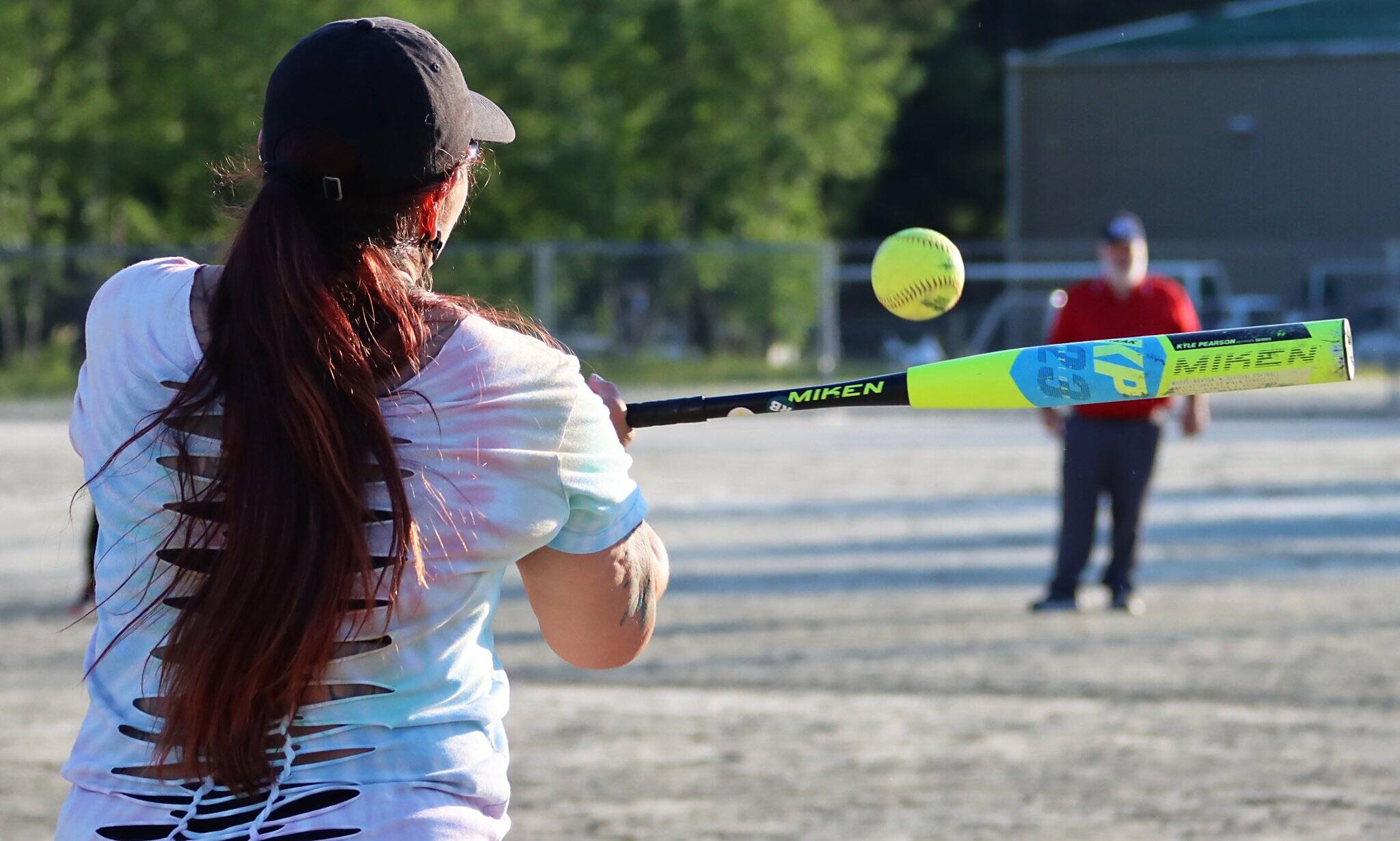 Davina Cole of Bat Attitudes swings at a pitch. (Courtesy Photo / Deb Baker)