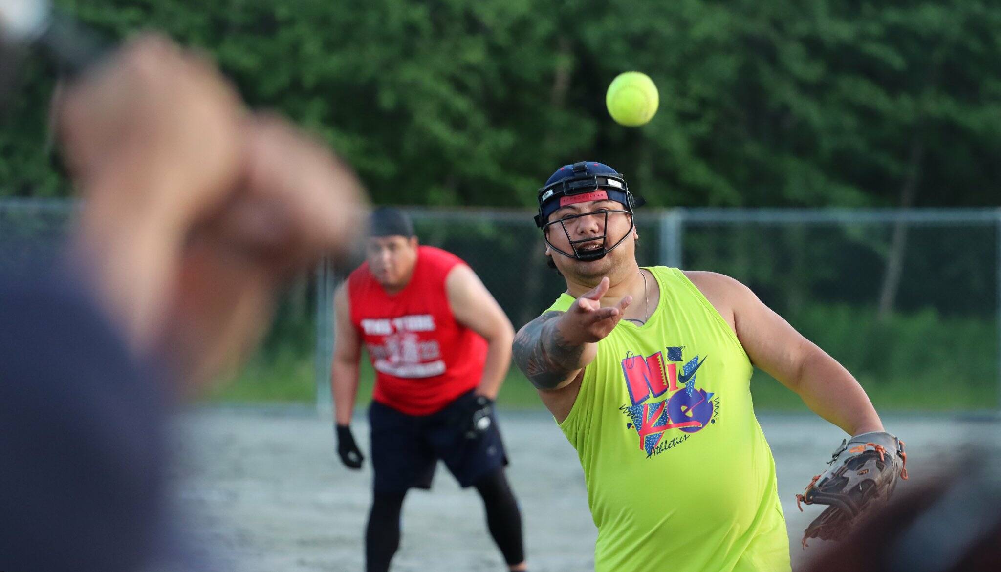 Courtesy Photo / Deb Baker 
Silver Maake of Joes Team Sucks lobs a pitch toward the plate while a member of The Tribe prepares to take off from second base.