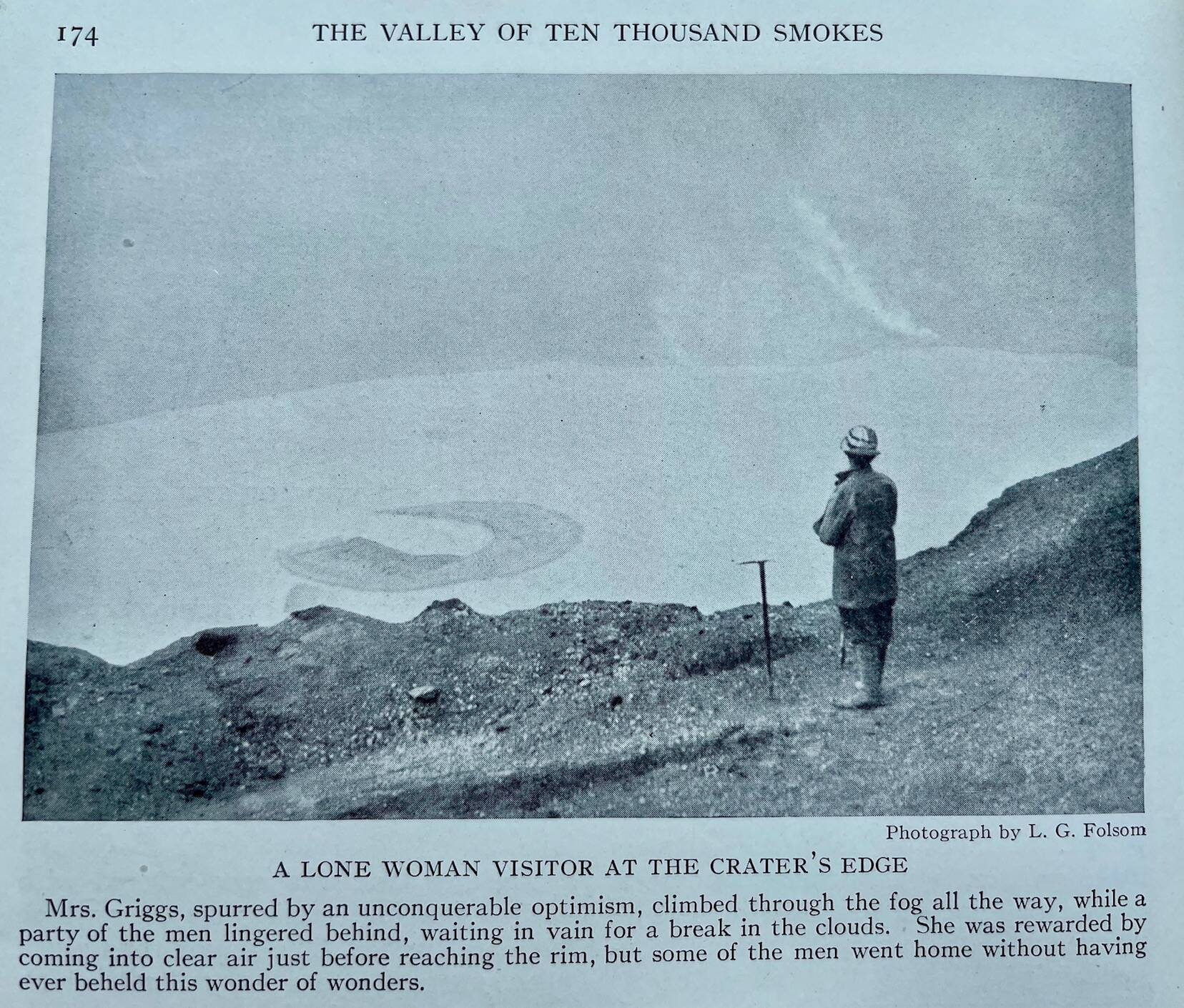 Laura Griggs, wife of botanist Robert Griggs, stands at the rim of Katmai Caldera, a crater located where the top of Mount Katmai stood before the 1912 eruption. (L.G. Folsom, from the book “The Valley of 10,000 Smokes” by Robert Griggs)