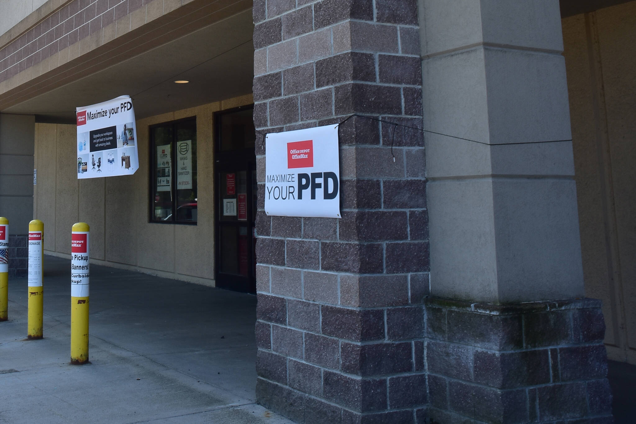 In this July 2020 photo, a sign on a Mendenhall Valley business advertises Permanent Fund dividend sales. Payments for this year’s PFD will start July 20, Gov. Mike Dunleavy announced Friday. (Peter Segall / Juneau Empire File)