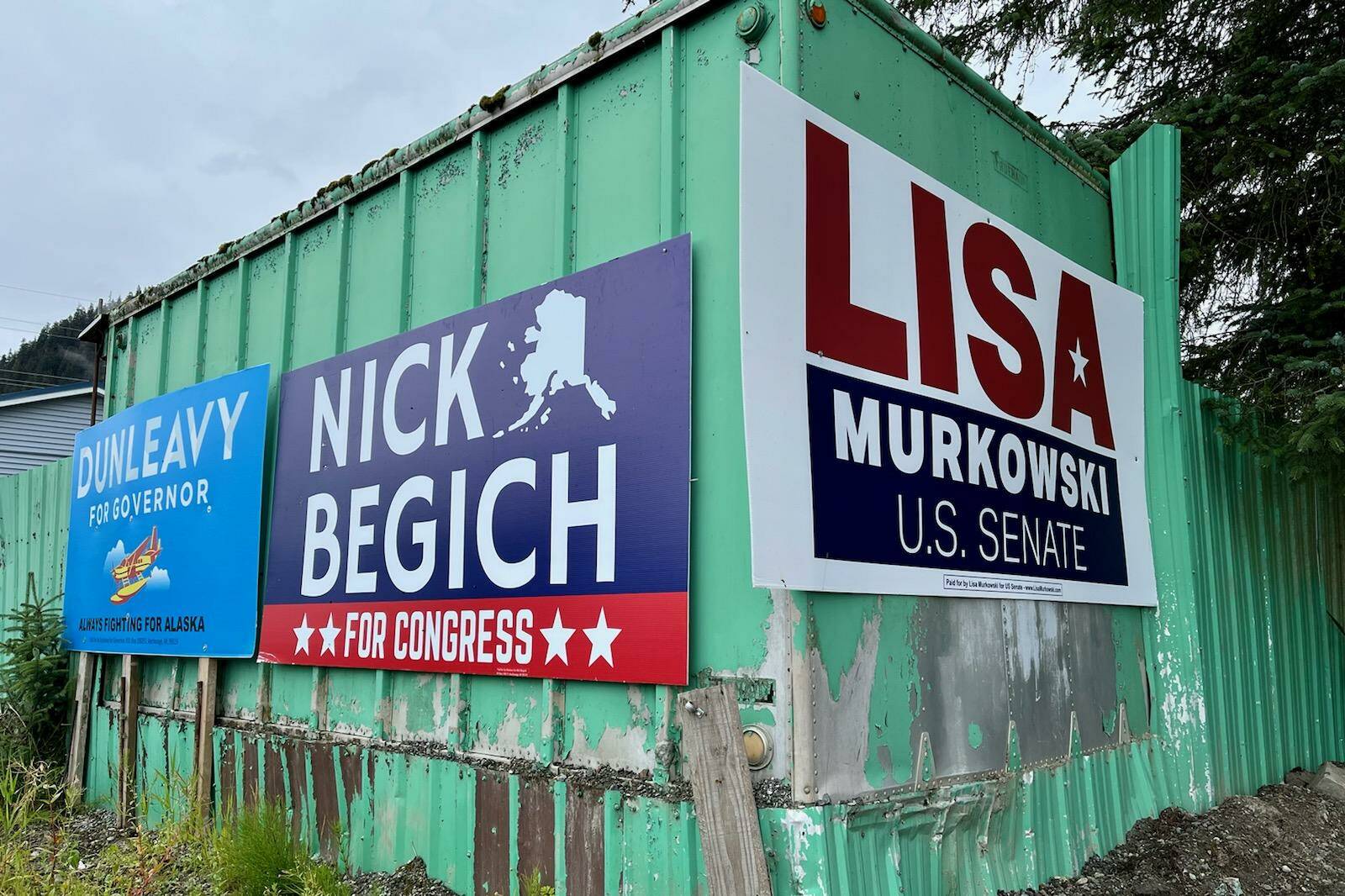 Campaign signs for Republican candidates leading in a recent poll in their respective races for governor, U.S. House and U.S. Senate hang from a structure near Juneau International Airport on Monday. Nick Begich and Lisa Murkowski, who had to file federal campaign donation reports by last Friday, also report having the most cash-on-hand by far in their races. (Jonson Kuhn / Juneau Empire)