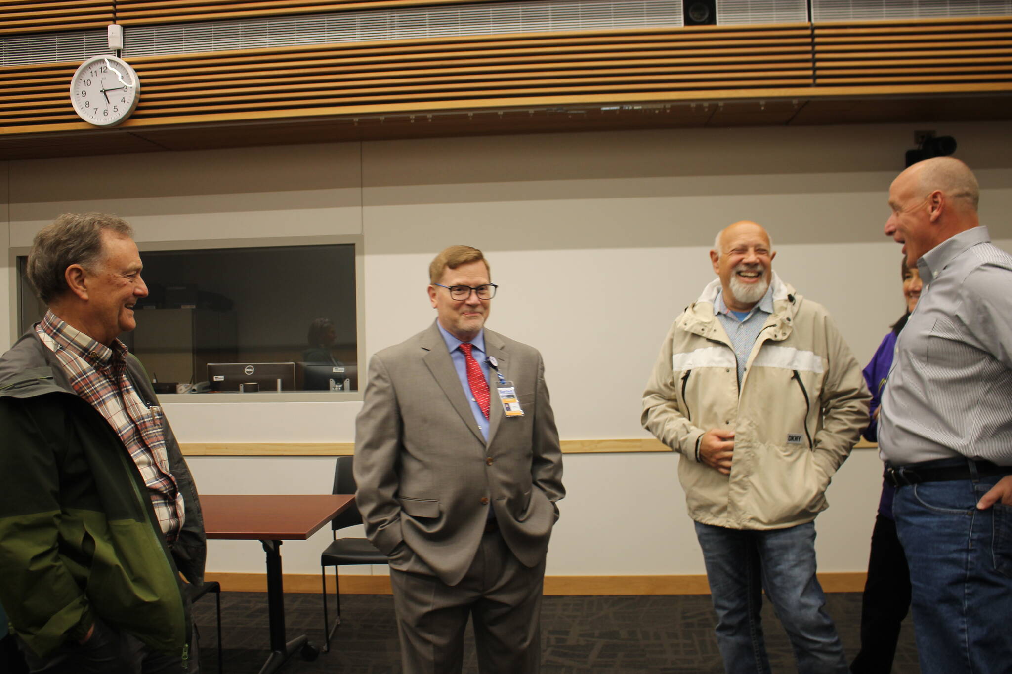 Bartlett Regional Hospital’s CEO finalist Jeffery Hudson-Covolo (left-center) chats with community members and members of the BRH Board of Directors at his public meet and greet for the potential position. (Clarise Larson / Juneau Empire)