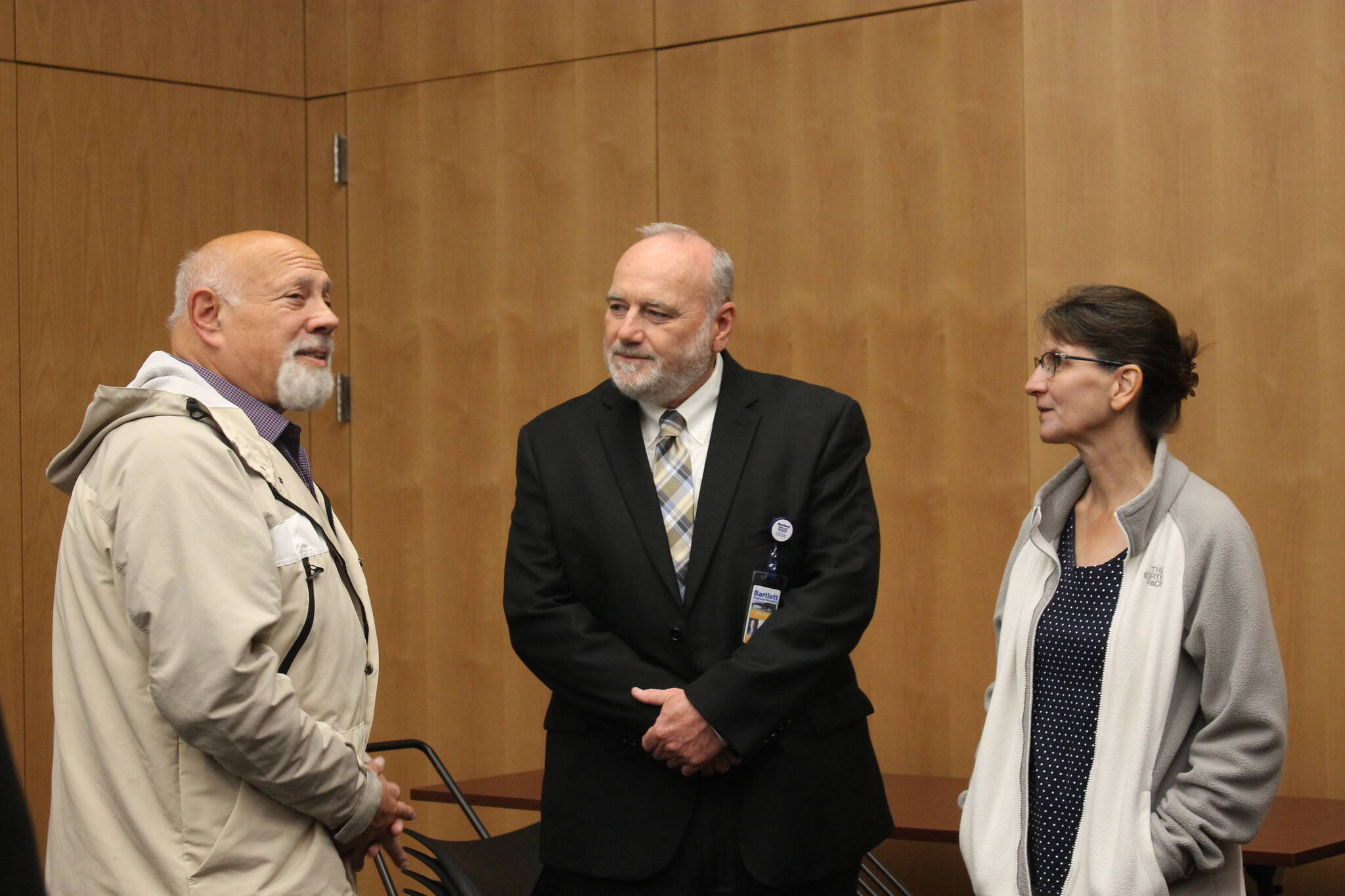 Bartlett Regional Hospital’s CEO finalist Dennis Welsh (center) chats with community members and members of the BRH Board of Directors at his public meet and greet for the potential position. (Clarise Larson / Juneau Empire)