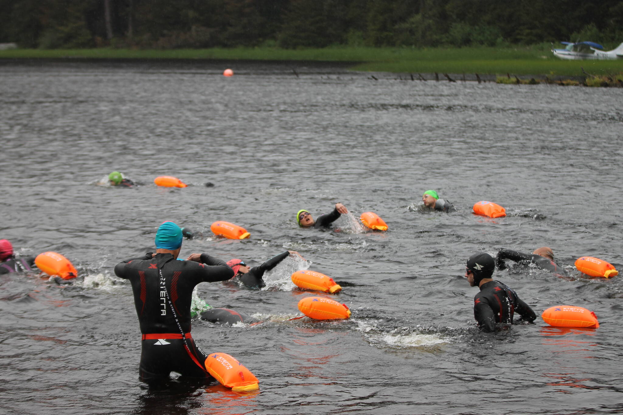 Clarise Larson / Juneau Empire 
Local athletes do a swim workout in Auke Lake as they prepare for the Ironman Alaska.