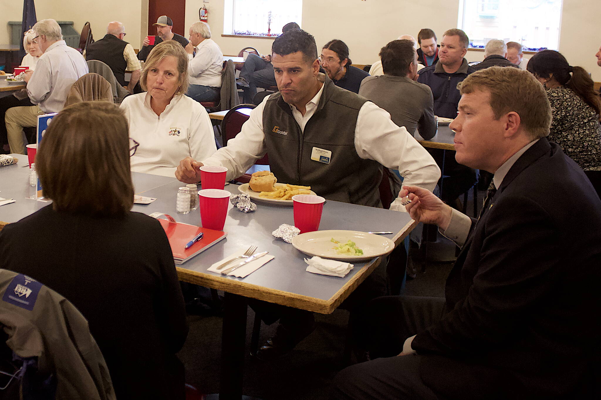 Ryan Anderson, right, commissioner of the Alaska Department of Transportation & Public Facilities, discusses his experiences during his 22 years at the department before his presentation during the weekly Juneau Chamber of Commerce lunch at The Moose Lodge. (Mark Sabbatini / Juneau Empire)