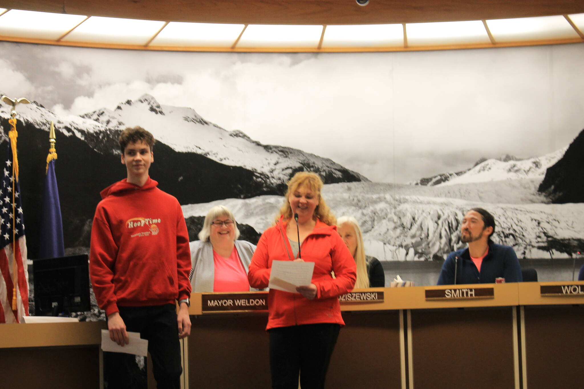 Ivan and Iryna Hrynchenko give a short speech at the City Borough of Juneau Assembly meeting Monday night. The mother and son are the first refugees from the war in Ukraine to be welcomed to the capital city. (Clarise Larson / Juneau Empire)