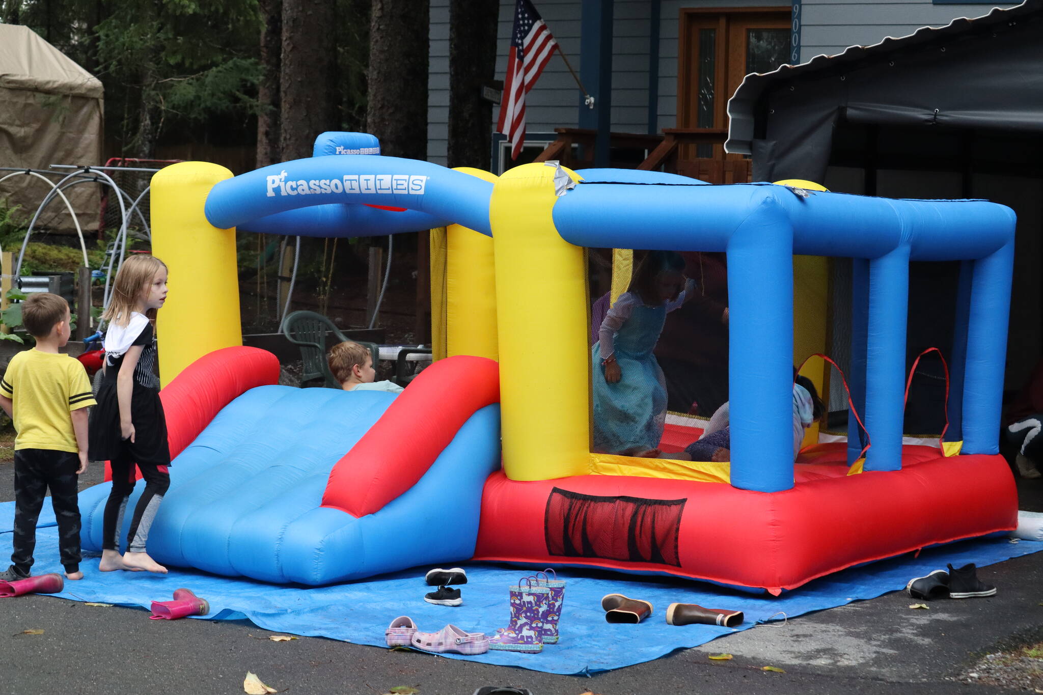 A bouncy castle along with games and snacks were prepared for the public on Firndale Street. They were also joined by first responders. (Jonson Kuhn / Juneau Empire)