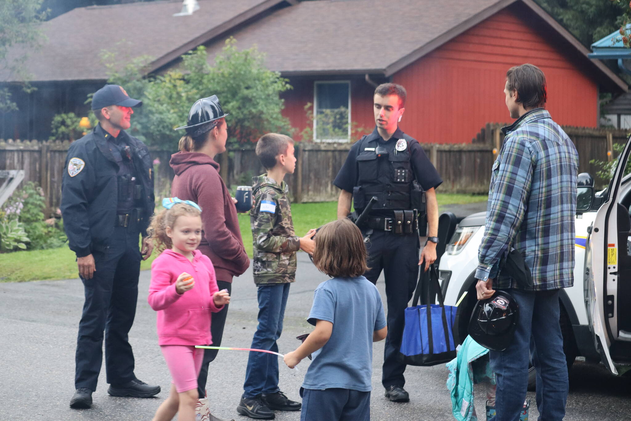 Kids and parents were given plenty of opportunities to meet and greet with Juneau’s first responders at the 14th annual National Night Out on Aug. 2. Photo taken on Skywood Lane. (Jonson Kuhn / Juneau Empire)