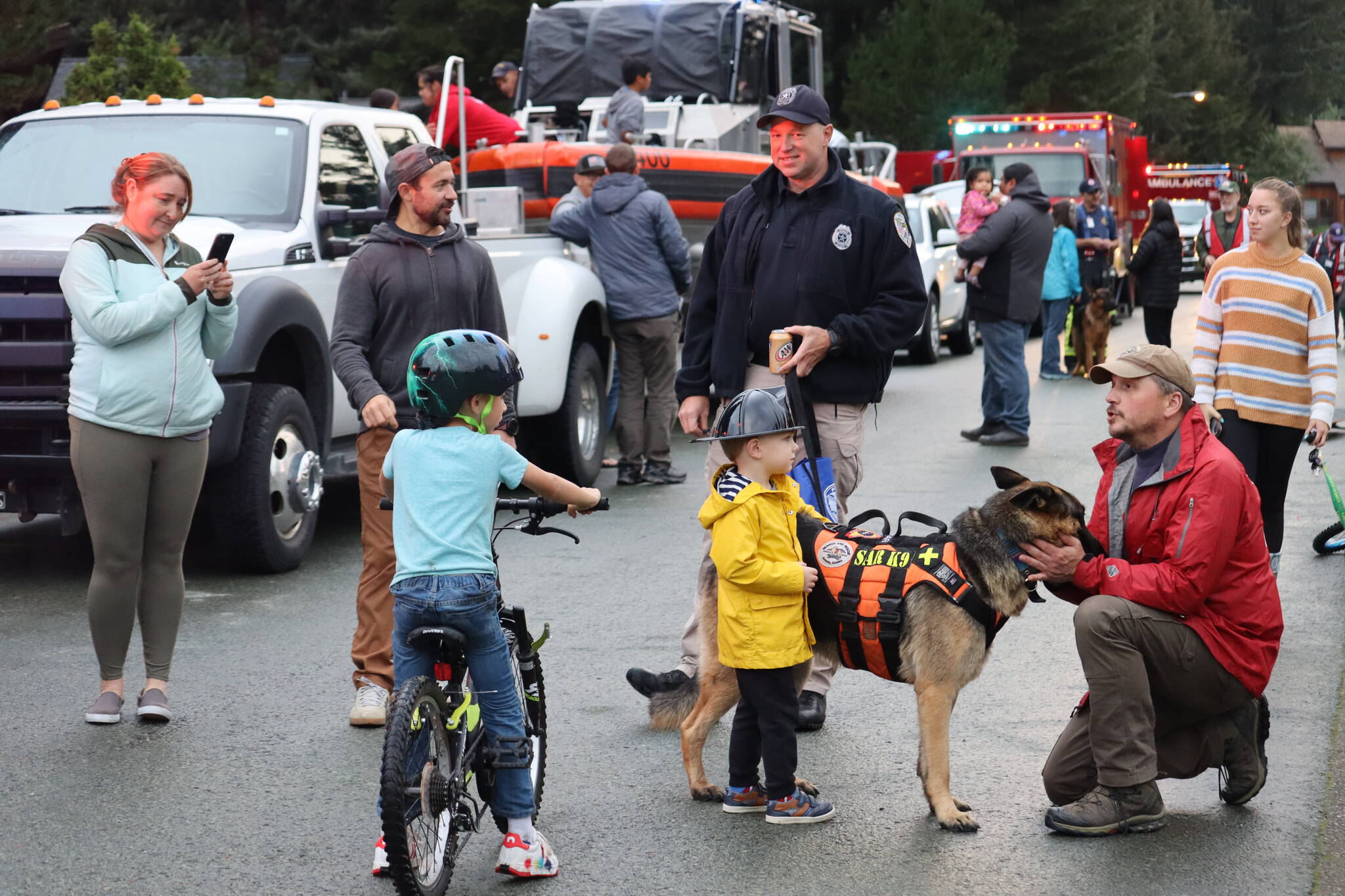Kids got a firsthand experience at meeting with first responders and their K-9 companions at National Night Out. Photo taken on Rivercourt Way. (Jonson Kuhn / Juneau Empire)