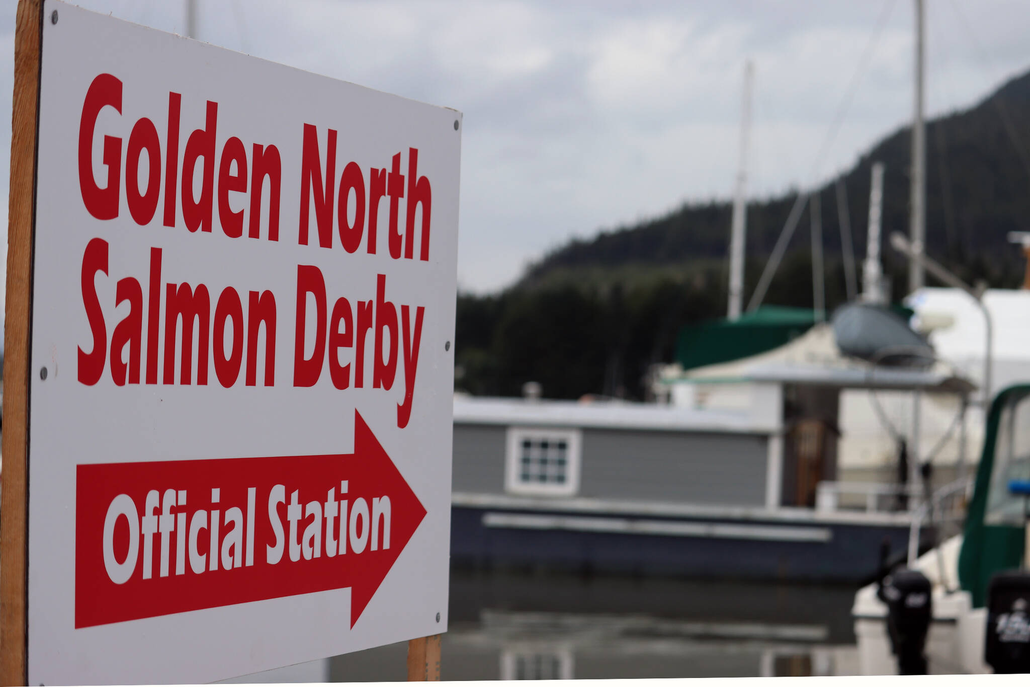 A sign points to a weigh-in station for the Golden North Salmon Derby in 2021. This year, the Auke Bay weight station will be at Auke Nu Cove, near the ferry terminal. (Ben Hohenstatt / Juneau Empire File)