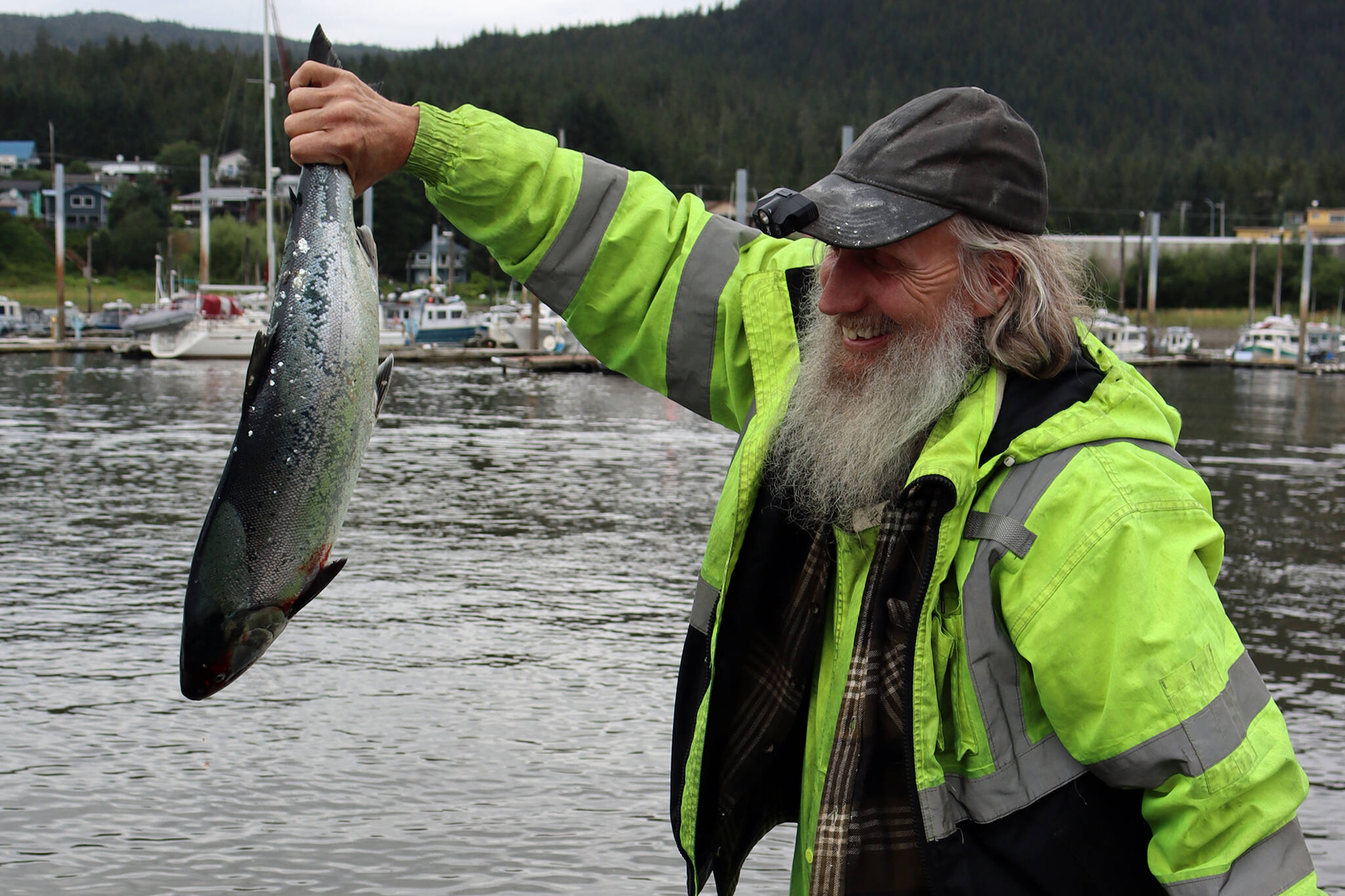 Eric Kirchner drops off one of several salmon during the 75th Golden North Salmon Derby in 2021. (Ben Hohenstatt / Juneau Empire)