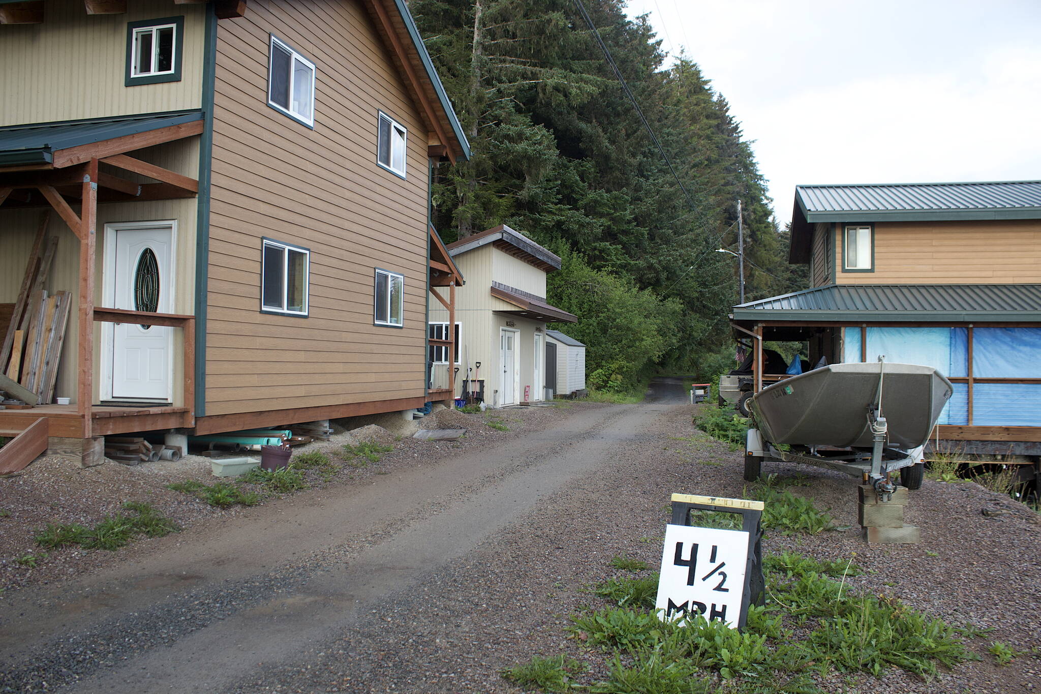 Mark Sabbatini / Juneau Empire
An unofficial 41⁄2-mph speed limit sign implores people to slow down from the official 10 mph limit while driving ATVs and bicycles on the dirt road passing through a trio of family homes on the outskirts of Tenakee Springs. A suggestion to impose an official 5 mph limit in some parts of the community where children frequent has been unsuccessfully made recently to the city council. No cars or trucks, except for two essential public service vehicles, are allowed in the town.