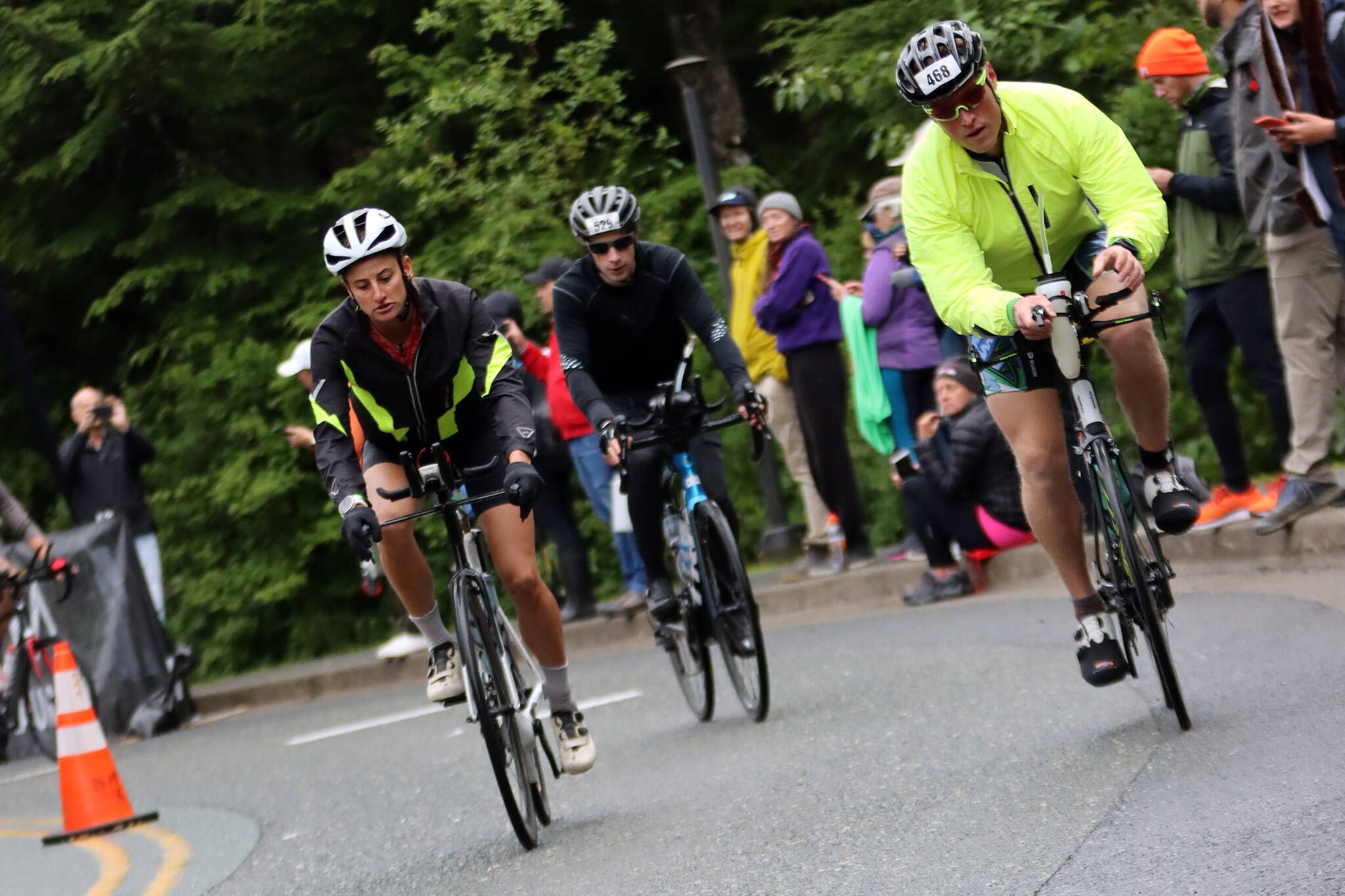 Cyclists pedal away from University of Alaska Southeast Sunday during Ironman Alaska, the first Ironman to be held in the state. The cycling portion of the event requires athletes to cover 112 miles. (Ben Hohenstatt / Juneau Empire)