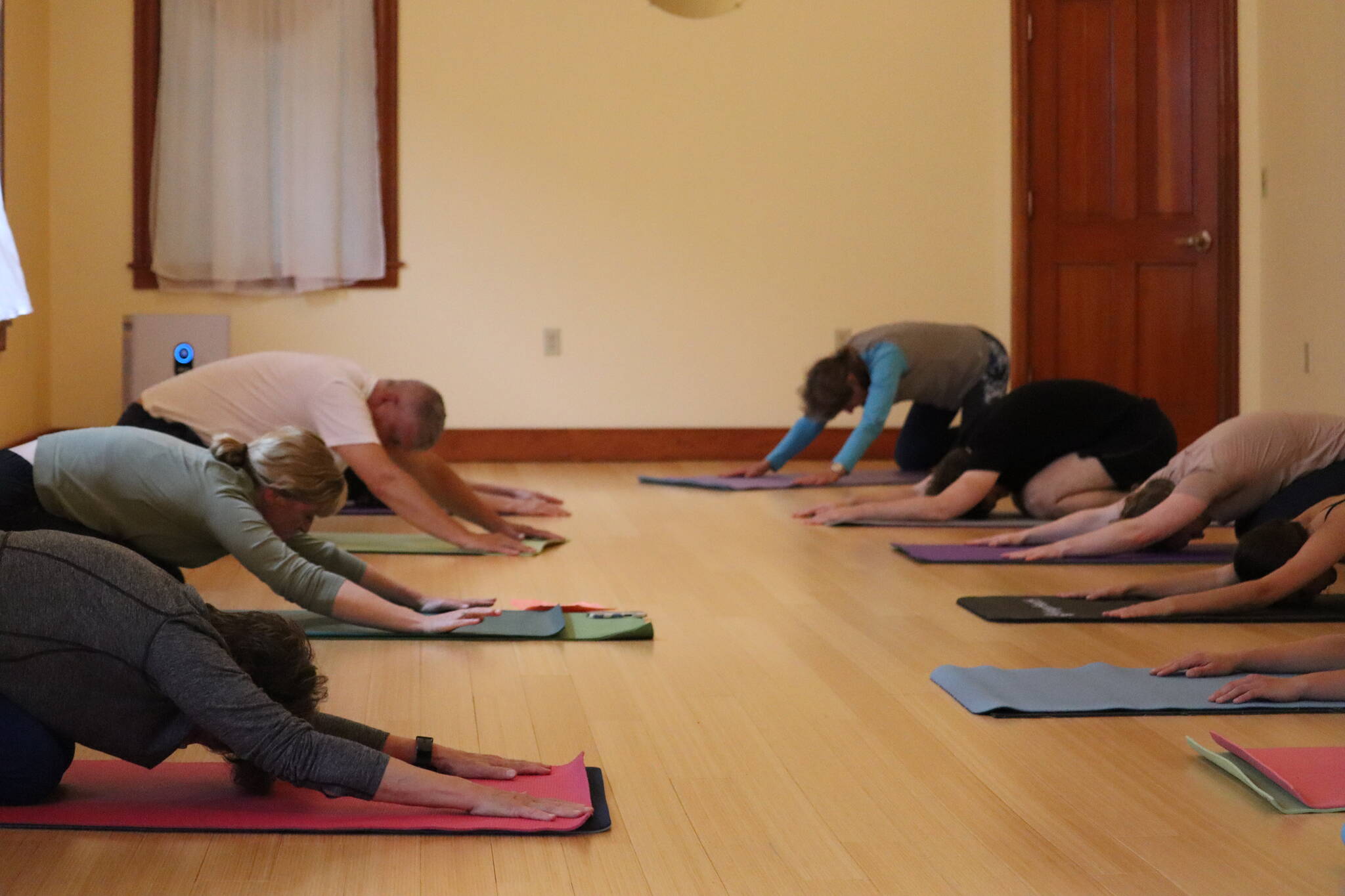 Kristin McTague led a free yoga/pilates class for First Friday at 171 Shattuck Way, suite 202 at Rainforest Yoga. The class incorporated warm ups, classical mat series and cool downs with no props needed. (Jonson Kuhn / Juneau Empire)