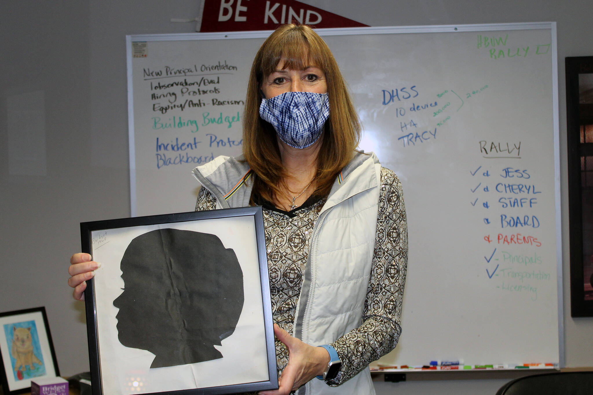 Juneau School District Bridget Weiss, shown in this September 2021 photo, shows an art project she completed as a kindergarten student at Harborview Elementary School. Weiss, superintendent since 2018, received a one-year extension of her contract until June of 2025 on Tuesday. (Dana Zigmund/Juneau Empire File)
