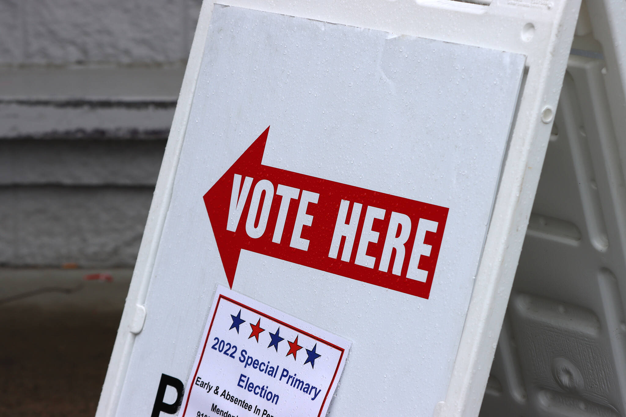A sign points voters toward an election center during the May special primary election. (Ben Hohenstatt / Juneau Empire File)