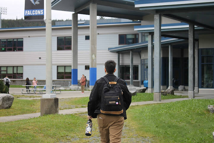 A student heads to the main entrance of Thunder Mountain High School to start the first day of school. (Clarise Larson / Juneau Empire)