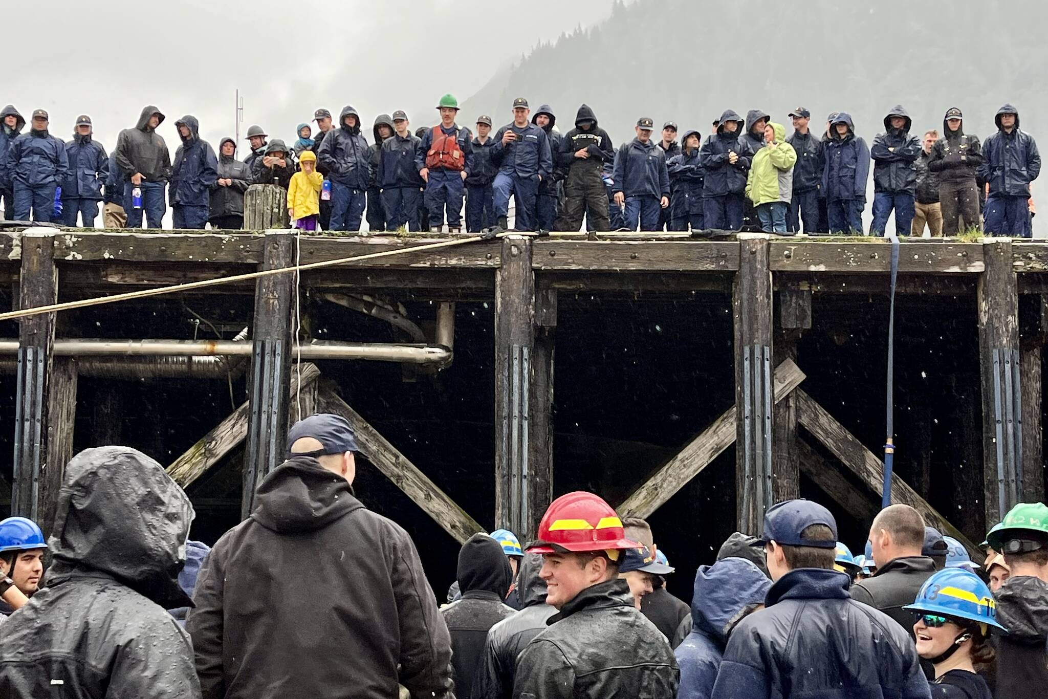 Despite the pouring rain, everyone still gathered high and low to cheer on different teams as they battled it out during the heat and beat competition for the annual Buoy Tender Olympics on Wednesday. (Jonson Kuhn / Juneau Empire)