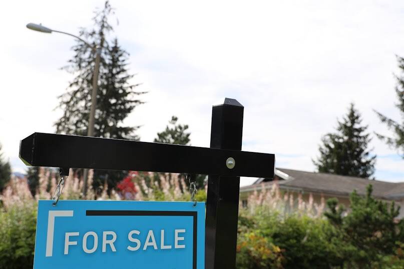 A for sale sign sits outside a house in the Mendenhall Valley area. The City Borough of Juneau’s finance staff recently released an online FAQ dedicated to answering a series of frequently asked questions about the borough’s real estate mandatory disclosure policy. (Clarise Larson / Juneau Empire)