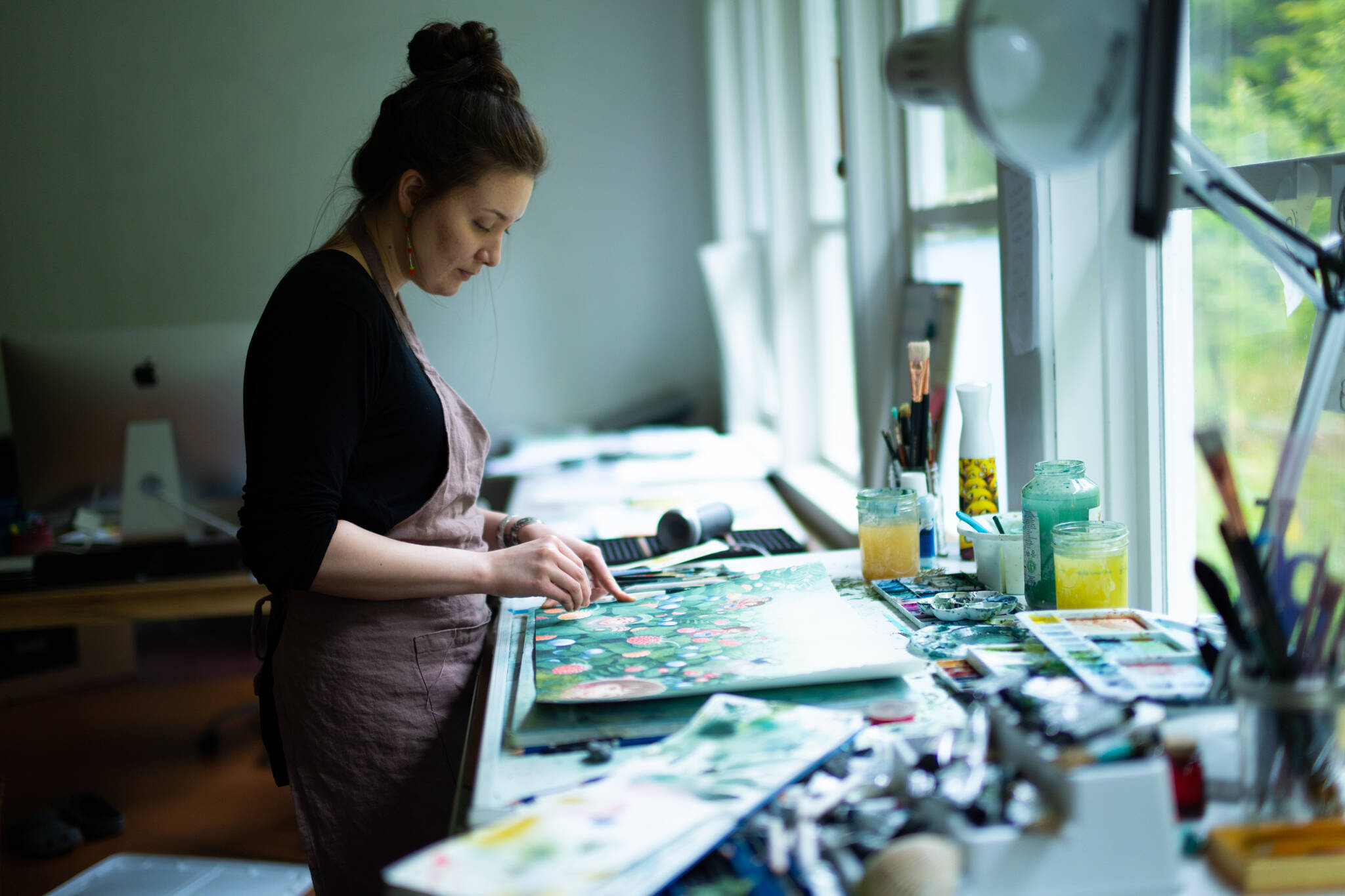 Michaela Goade, an award-winning illustrator who recently released the book “Berry Song,” works in her studio. (Courtesy Photo / Bethany Goodrich)