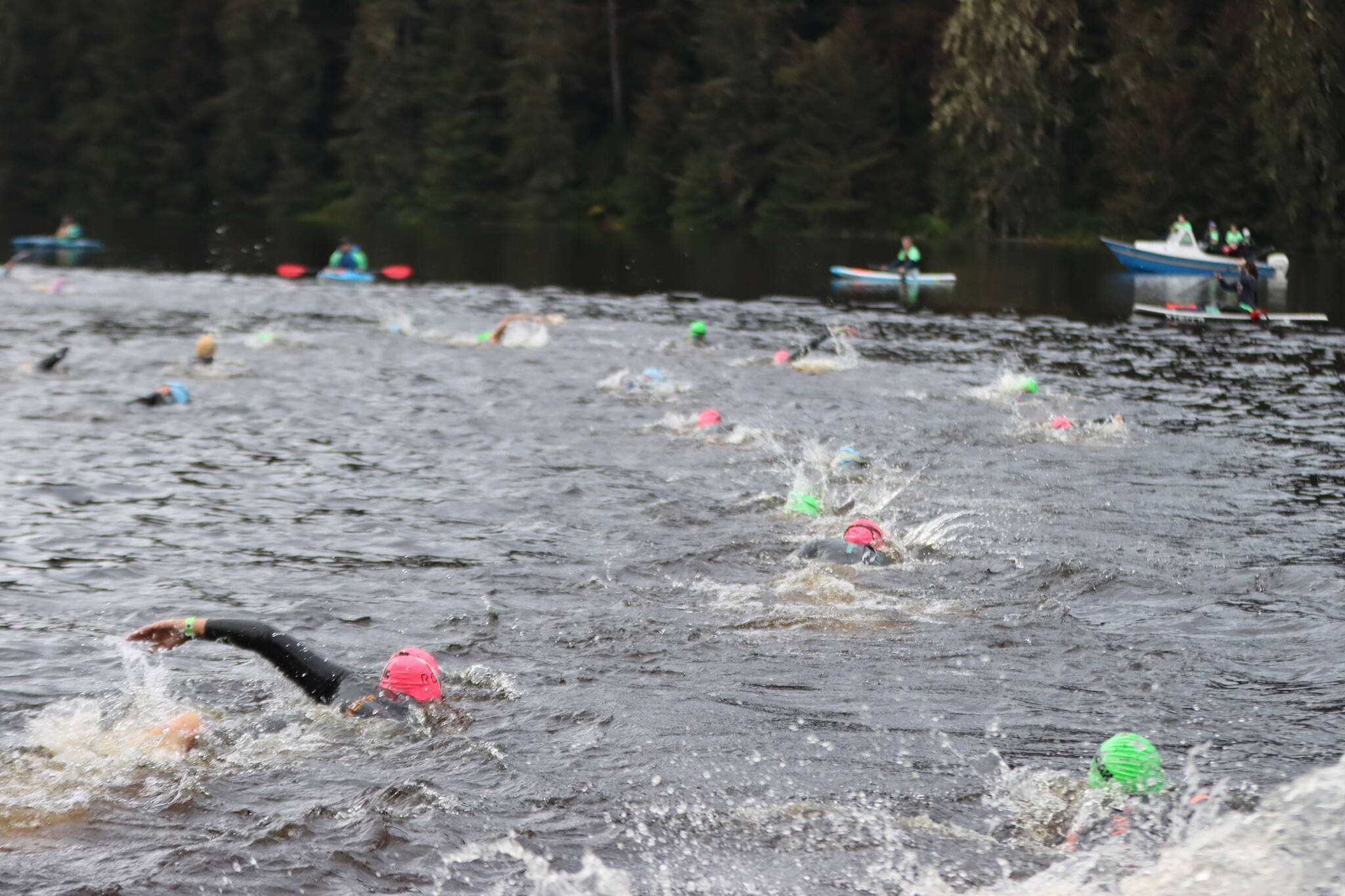 Swimmers quickly work their way away from shore during Ironman Alaska. (Ben Hohenstatt / Juneau Empire File)