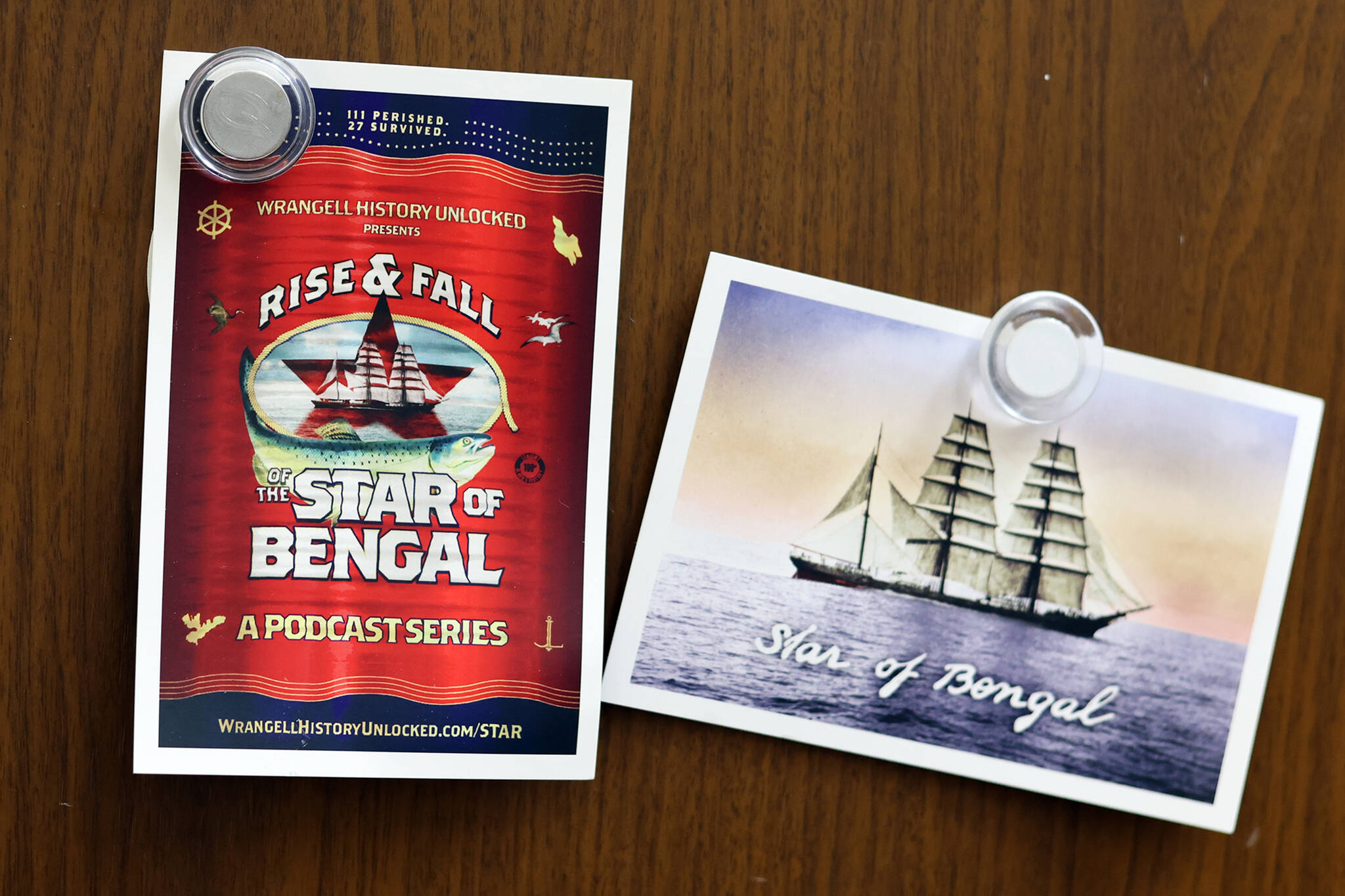 Postcards promoting a new podcast about the Star of Bengal hang on a Juneau refrigerator. A five-part series about a	1908 shipwreck near Wrangell that killed 111 of the 138 men on board, mostly Asian cannery workers returning home, will be narrated by various current and former residents of the community in a five-part weekly podcast starting Friday .(Ben Hohenstatt / Capital City Weekly)