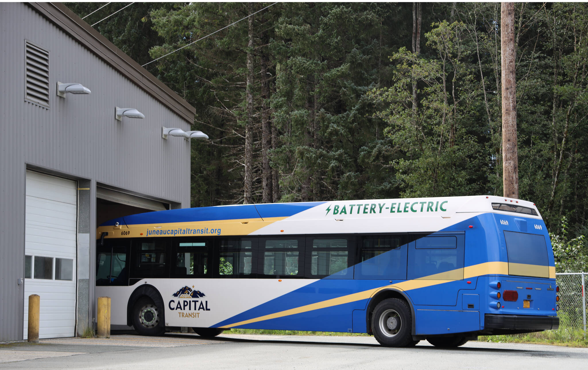 The only electric bus enters the City Borough of Juneau Capital Transit’s bus barn on Tuesday afternoon. Capital Transit is preparing for the addition of seven electric buses which are slated to hit Juneau’s roads sometime in 2024. (Clarise Larson / Juneau Empire)