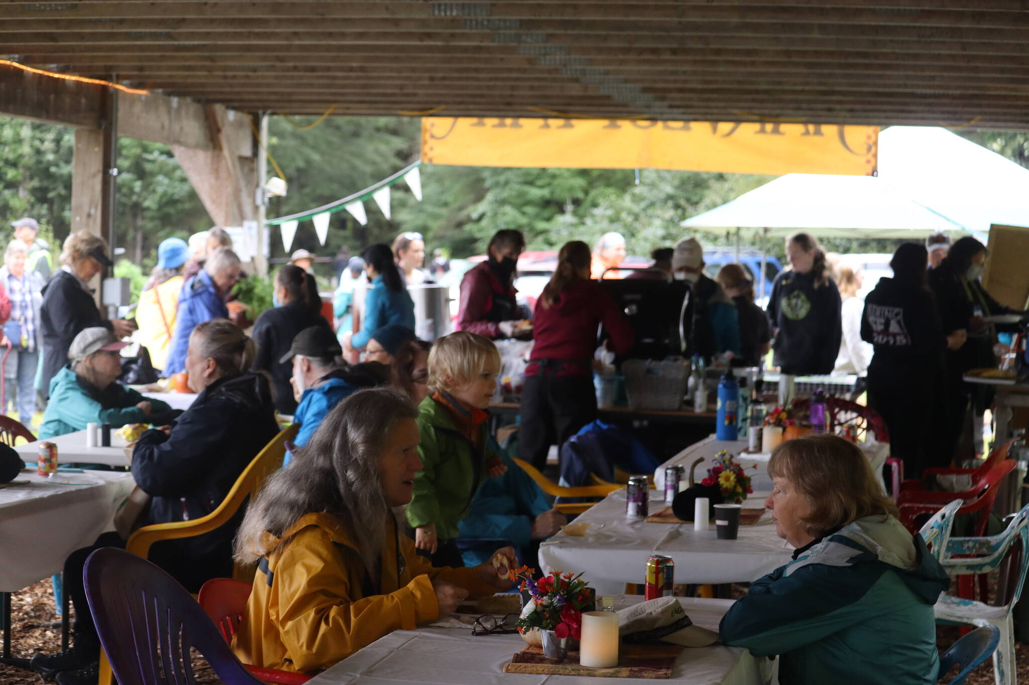 Despite the morning rain, there was a large turnout on Saturday for the 28th Annual Juneau Community Garden Harvest Fair, which featured concessions and a bake sale. (Jonson Kuhn / Juneau Empire)