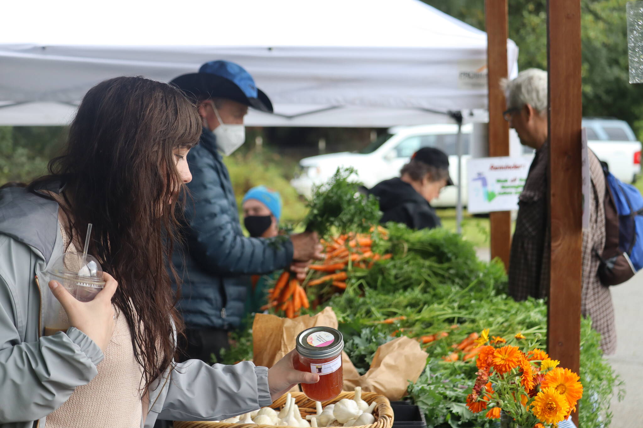 Fresh produce and flowers straight from the Juneau Community Garden were offered at the farmer’s market this year, along with jams and honey on Saturday at the Annual Juneau Community Garden Harvest Fair. (Jonson Kuhn / Juneau Empire)