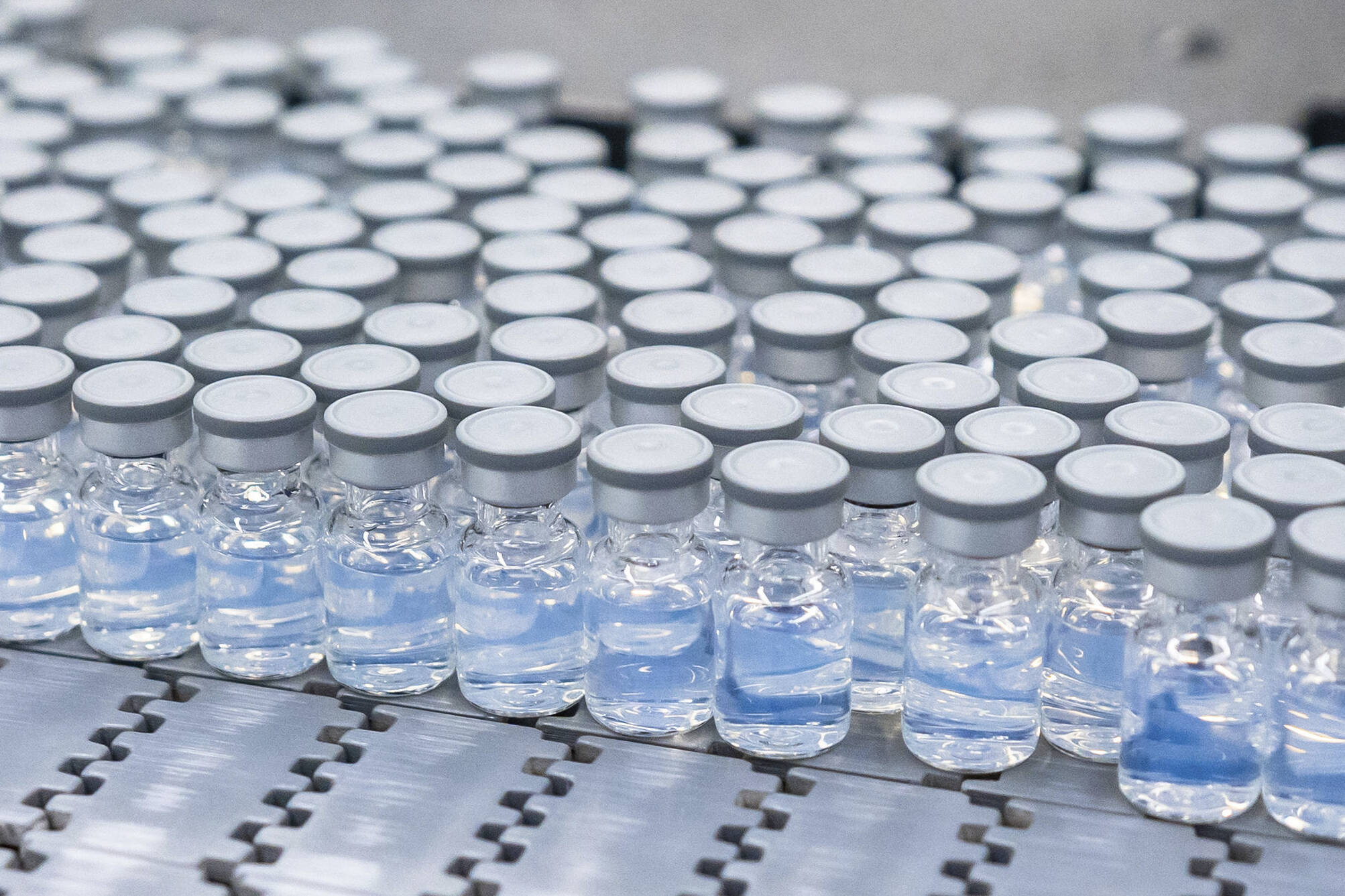 This August 2022 photo provided by Pfizer shows vials of the company’s updated COVID-19 vaccine during production in Kalamazoo, Mich. New boosters targeting the most prevalent strains of the virus that causes COVID are expected to be available in Juneau starting next week. (Pfizer)