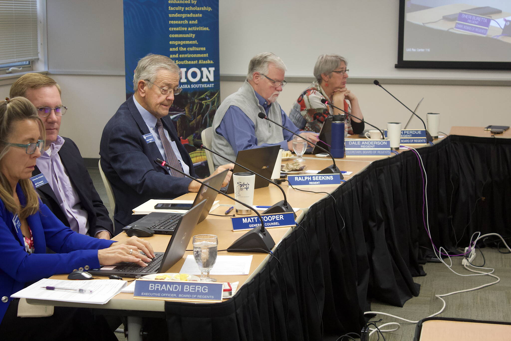 Members of the University of Alaska’s Board of Regents and staff members participate in the board’s first meeting in Juneau on Thursday at the University of Alaska Southeast. (Mark Sabbatini / Juneau Empire)