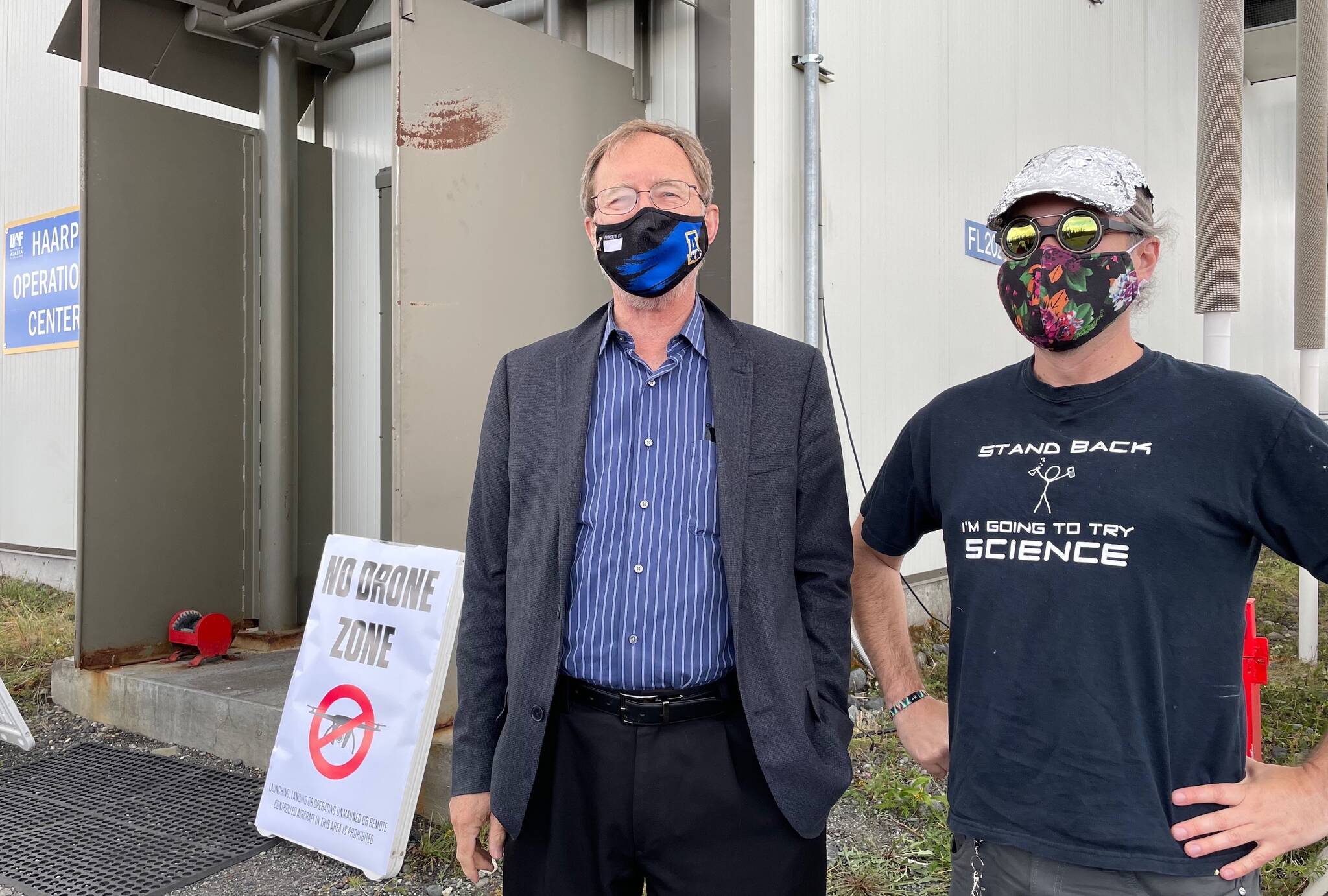 Geophysical Institute Director Bob McCoy poses with visitor Michael Lewis from Anchorage during a recent open house of the ionosphere-heating facility known as HAARP between Glennallen and Tok. (Courtesy Photo / Ned Rozell)