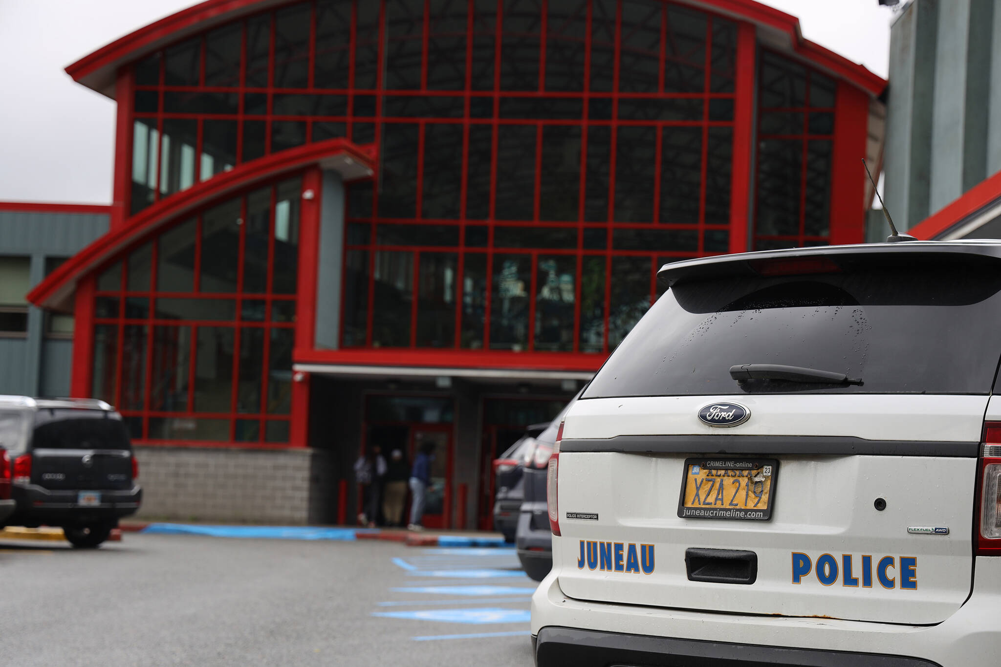 A Juneau Police Department vehicle parks in front of Juneau-Douglas High School: Yadaa.at Kalè on Friday, Sept. 9. (Clarise Larson / Juneau Empire)