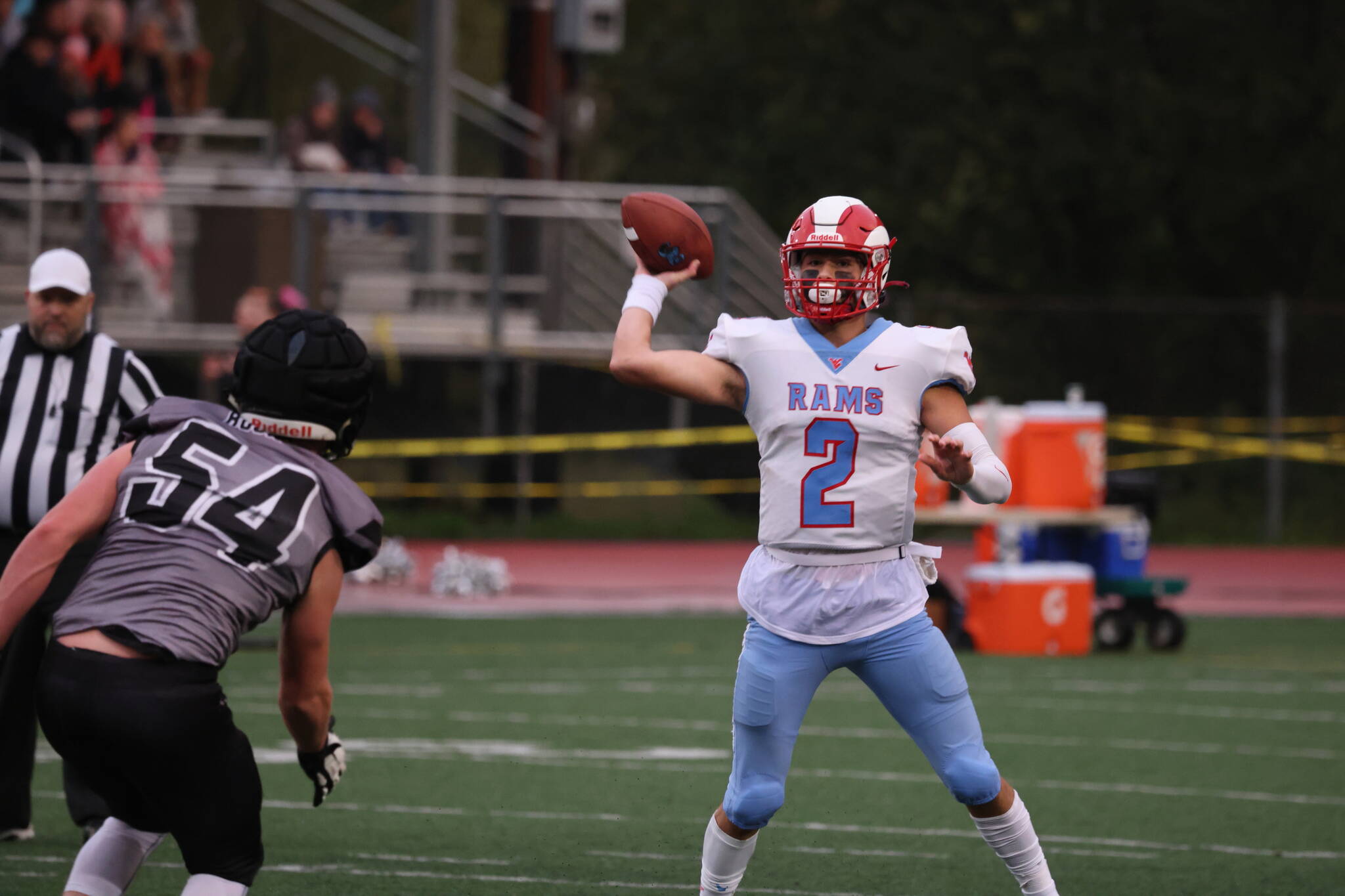 West Valley quarterback Skyler Cassel prepares to throw a pass while under pressure from the Huskies defense. Throughout the game, Cassel proved to be evasive, often extending plays and eluding the Juneau rush. (Ben Hohenstatt / Juneau Empire)