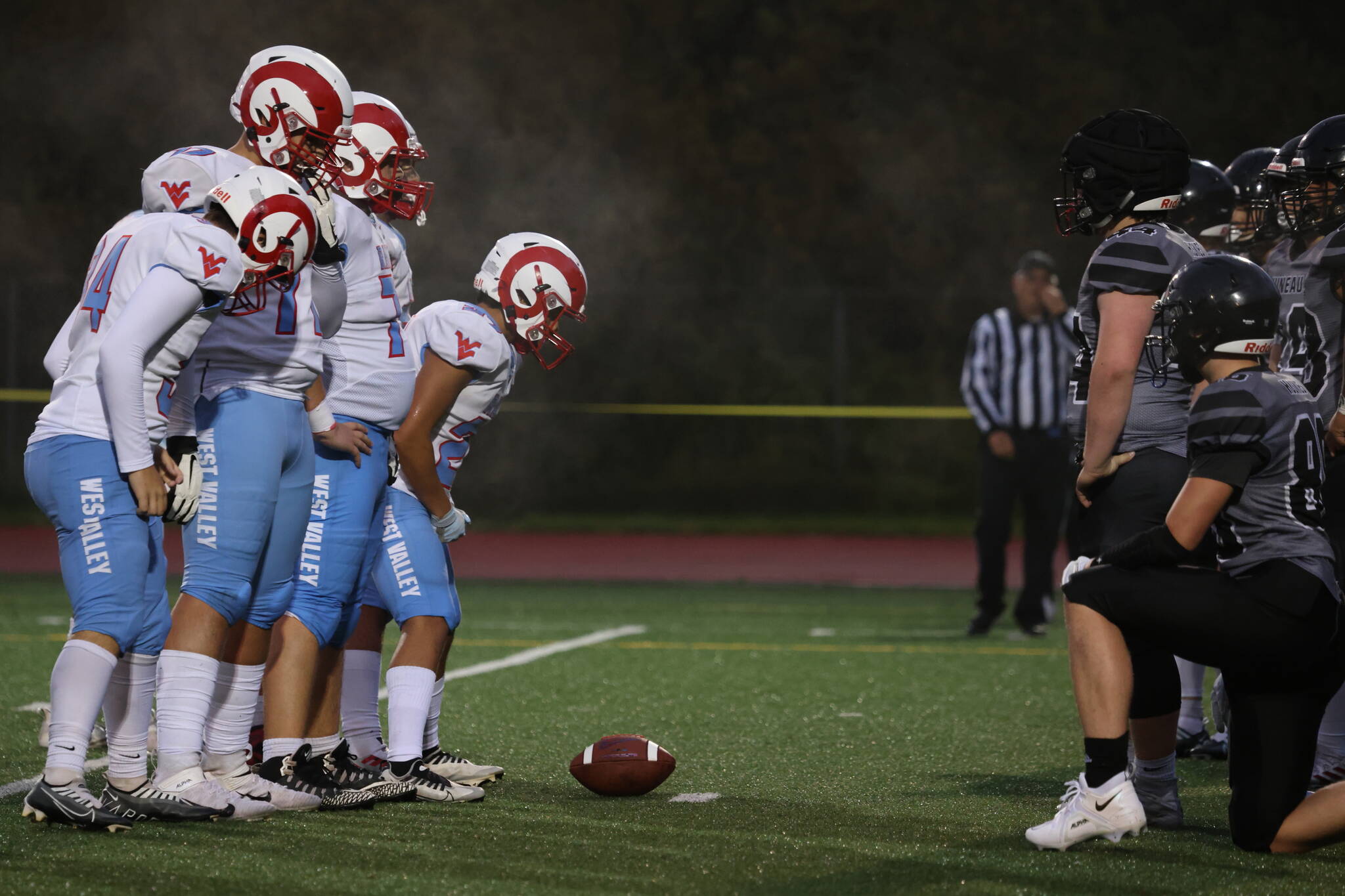 The West Valley Rams offense prepares to get set at the line of scrimmage. (Ben Hohenstatt / Juneau Empire)