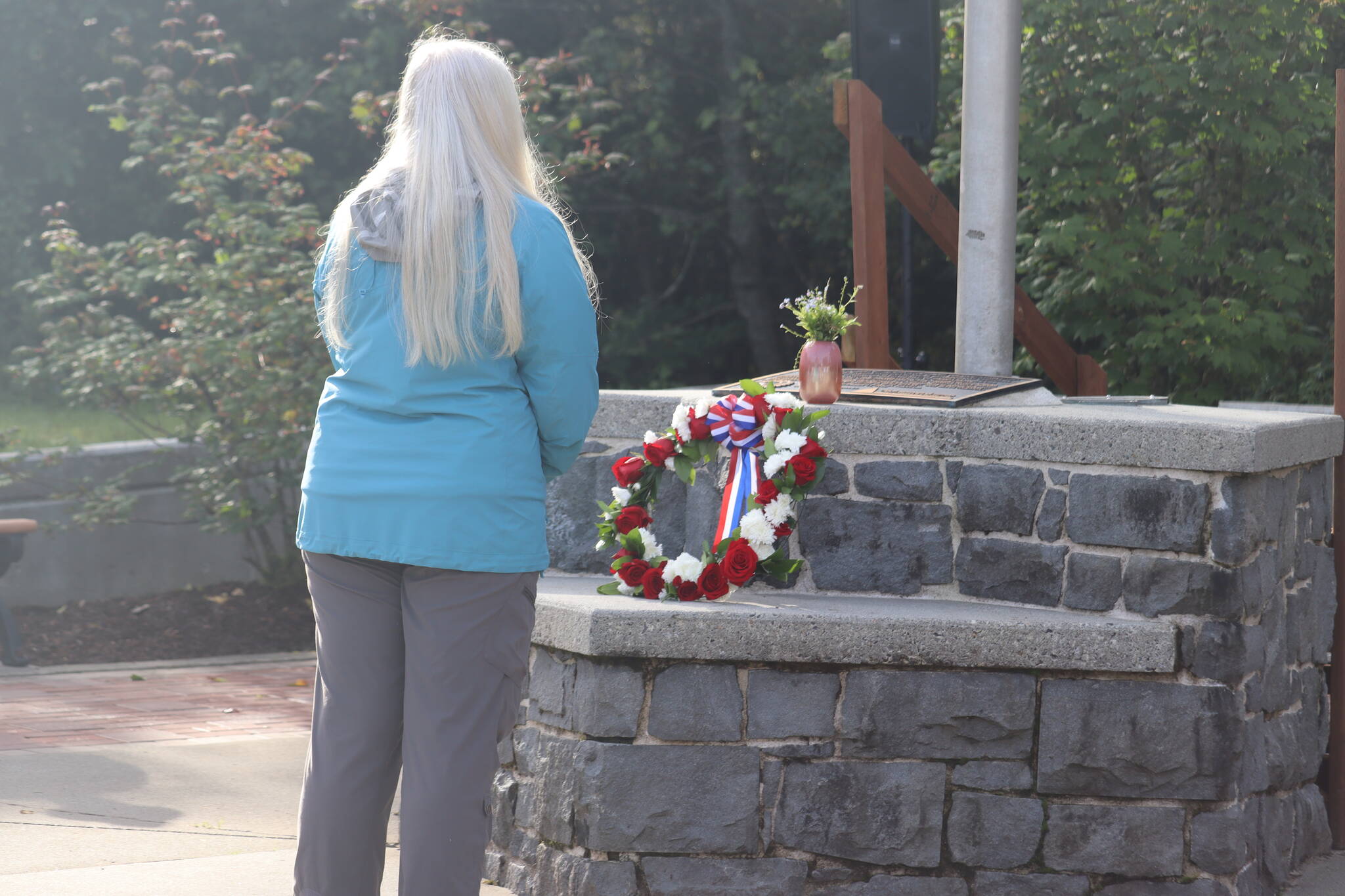 Juneau Deputy Mayor and former EMT Maria Gladziszewski laid a wreath at the memorial during Sunday’s ceremony as a way of paying tribute to those who lost their lives during the events of Sept. 11, 2001. (Jonson Kuhn / Juneau Empire)
